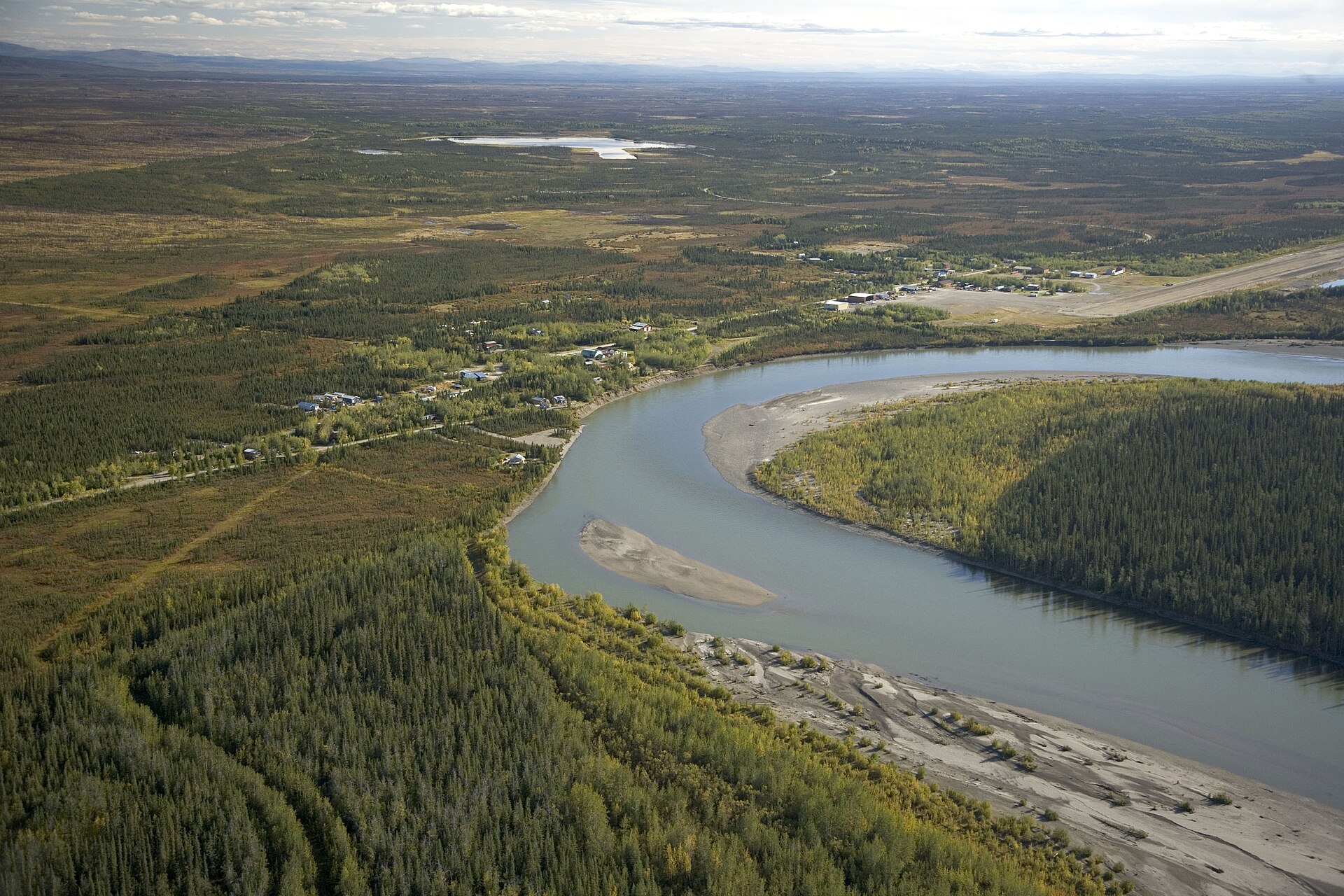 Aerial view of Bettles (right) and Evansville (left), in the U.S. state of Alaska. The river in the foreground is the Koyukuk River.