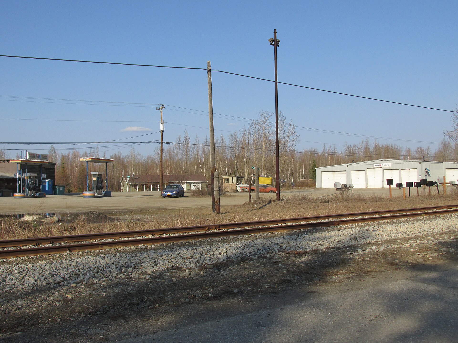 The "main intersection" of Moose Creek, Alaska, located a short distance from the exit off the Richardson Highway. Shown is part of the Moose Creek General Store (left) and First Student bus barn (right)