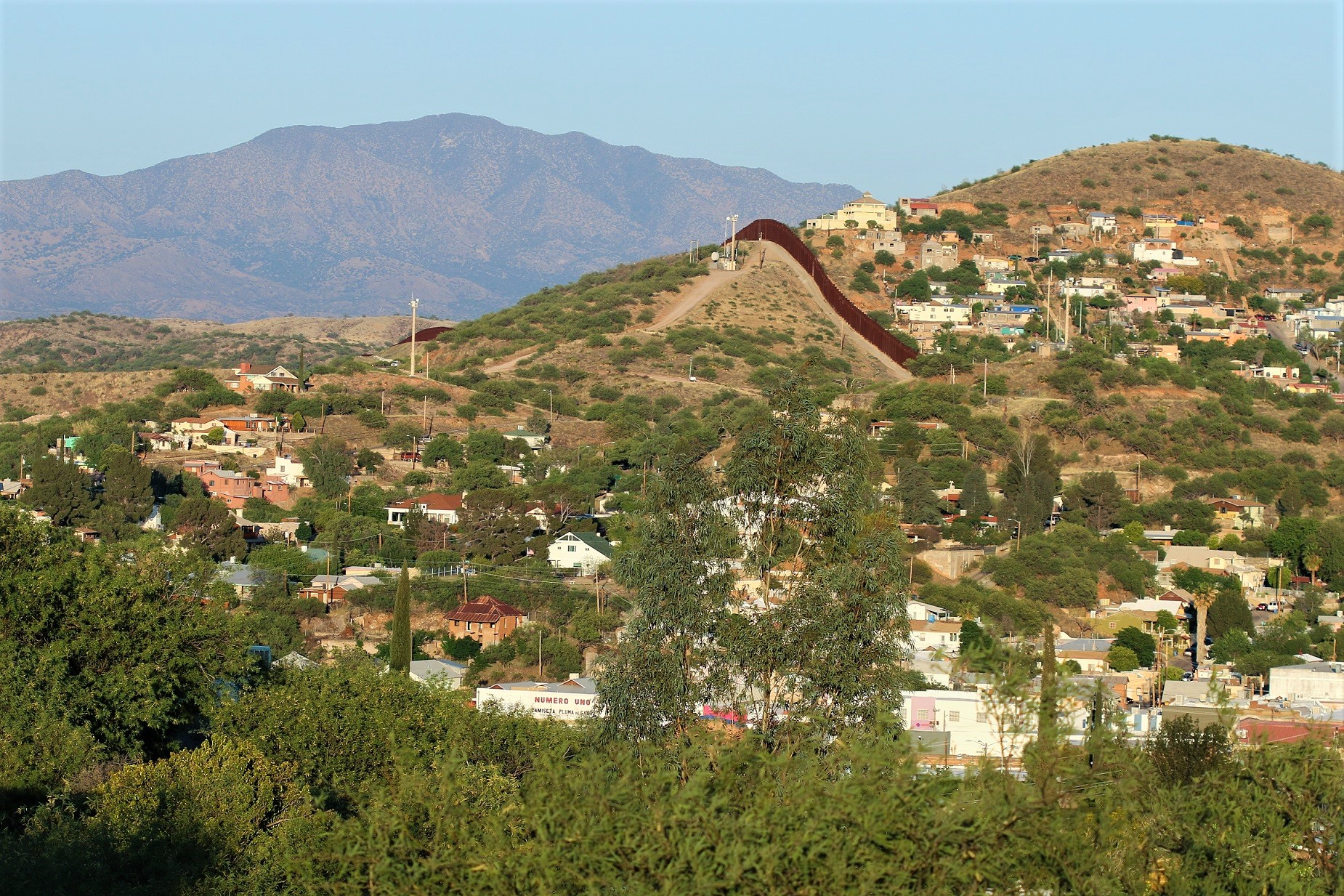 View of Nogales, Arizona/Sonora — from Arizona. The fence dividing Arizona and Mexico is visible in center of photo.
