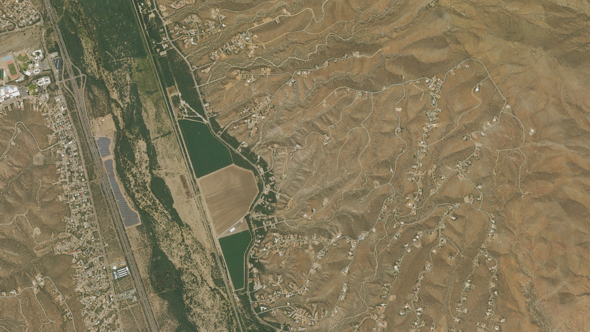 Natural-color aerial photograph of land around Rio Rico, Arizona