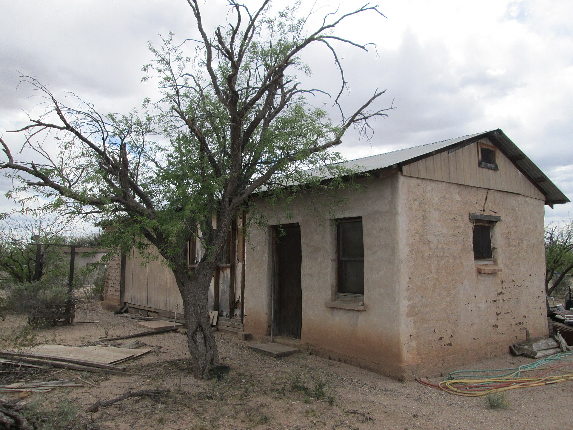 An old adobe ranch house that was built in the 1940s or 1950s in Summit, Arizona.