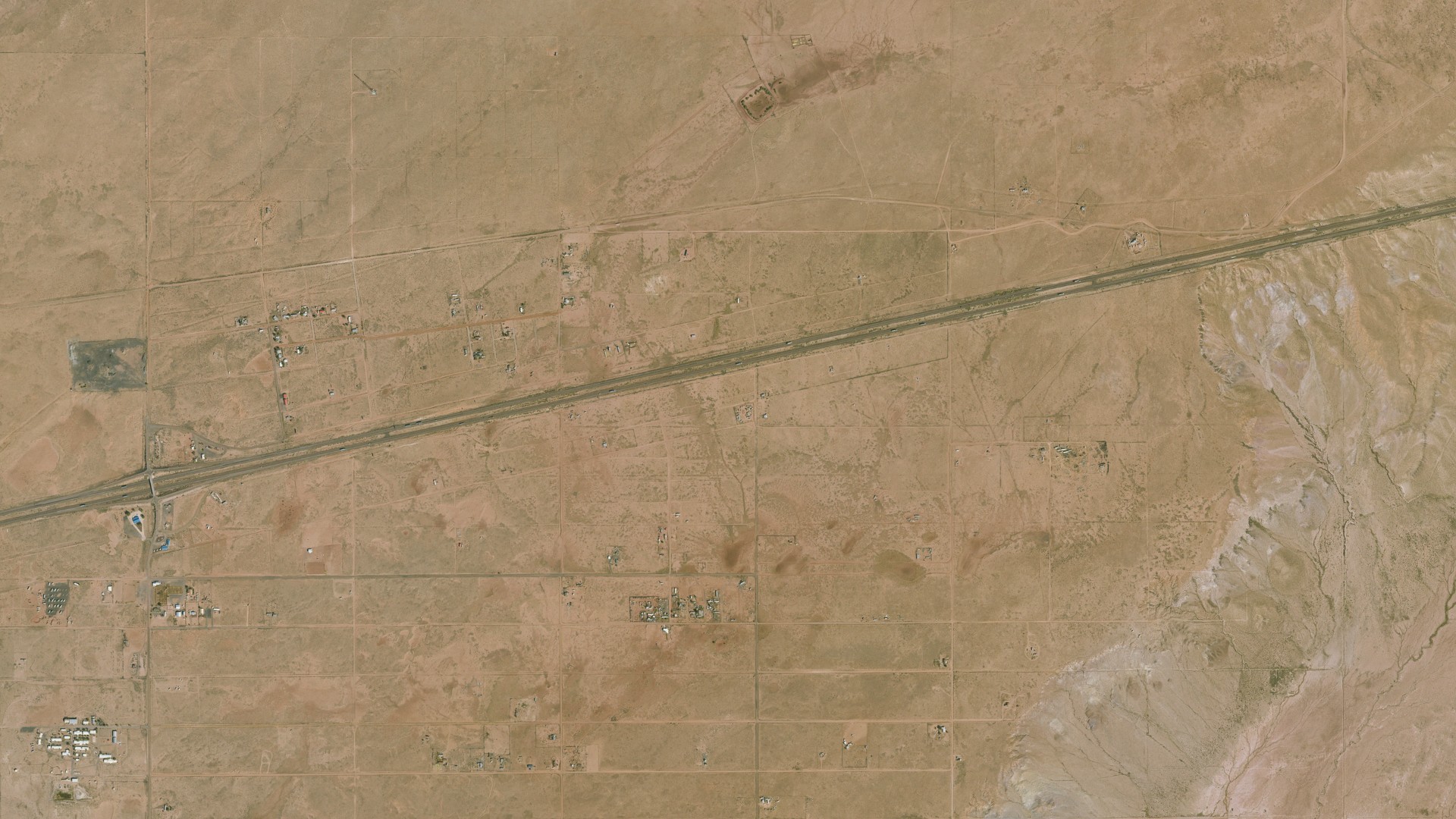 Natural-color aerial photograph of land around Sun Valley, Arizona