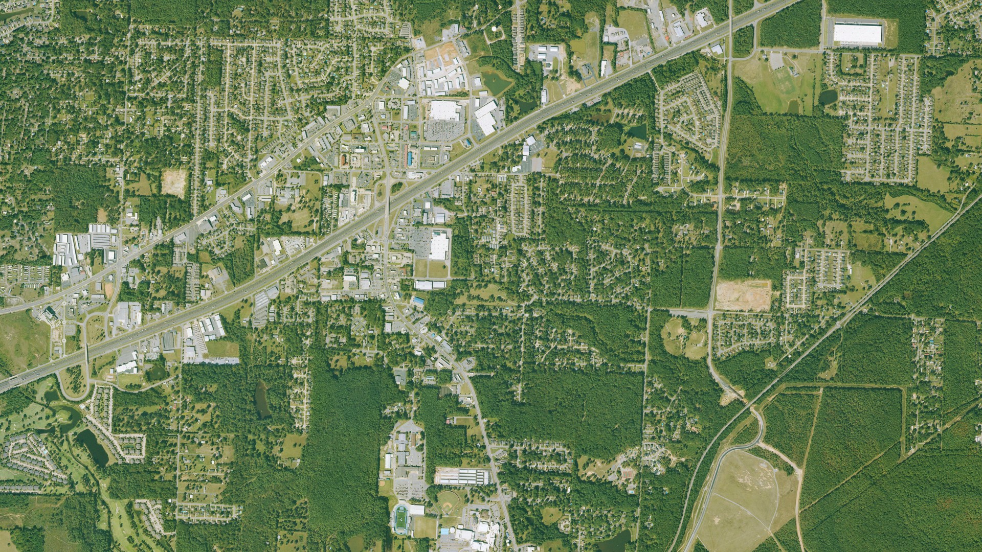 Natural-color aerial photograph of land around Bryant, Arkansas
