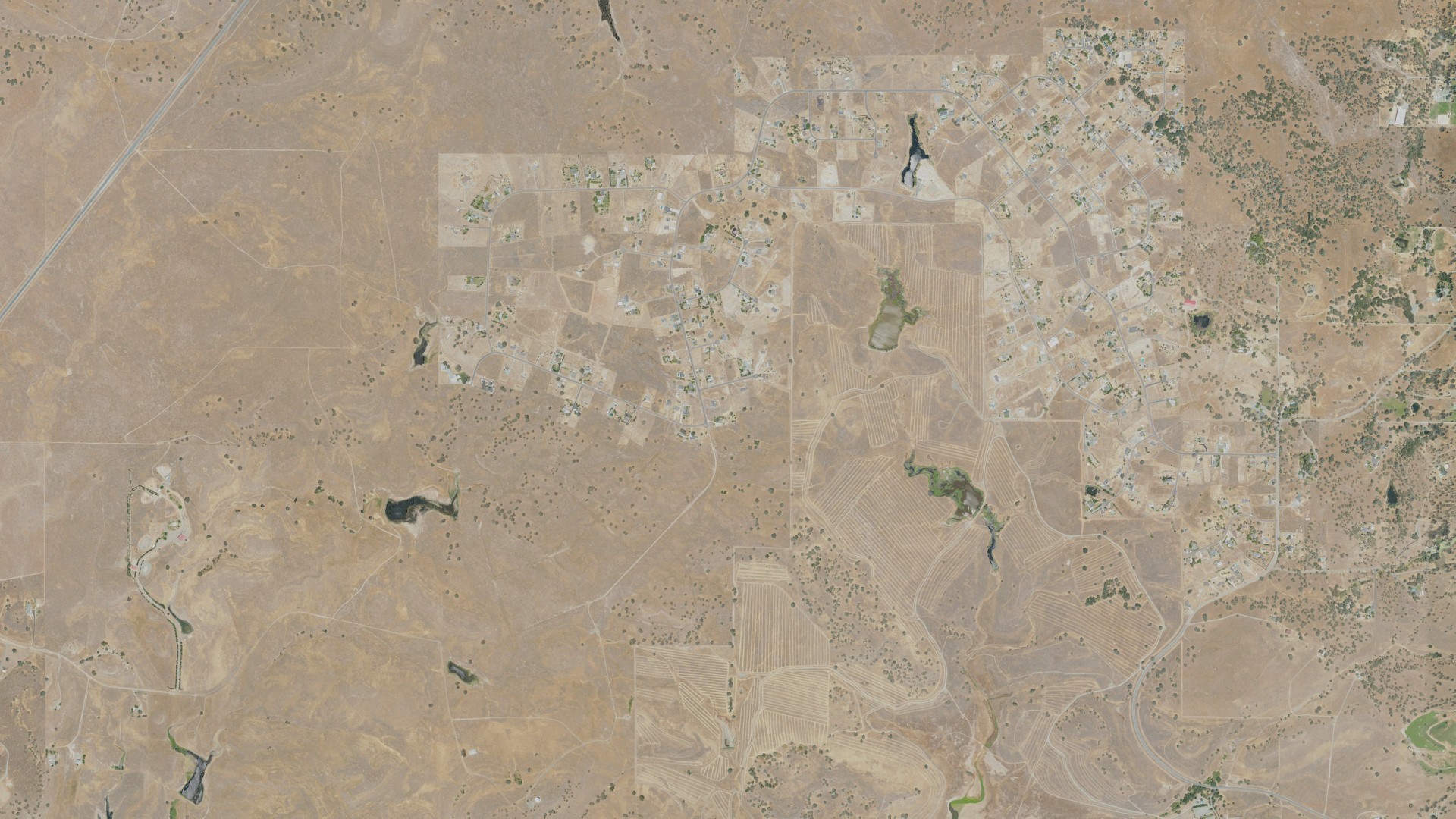 Natural-color aerial photograph of land around Camanche Village, California