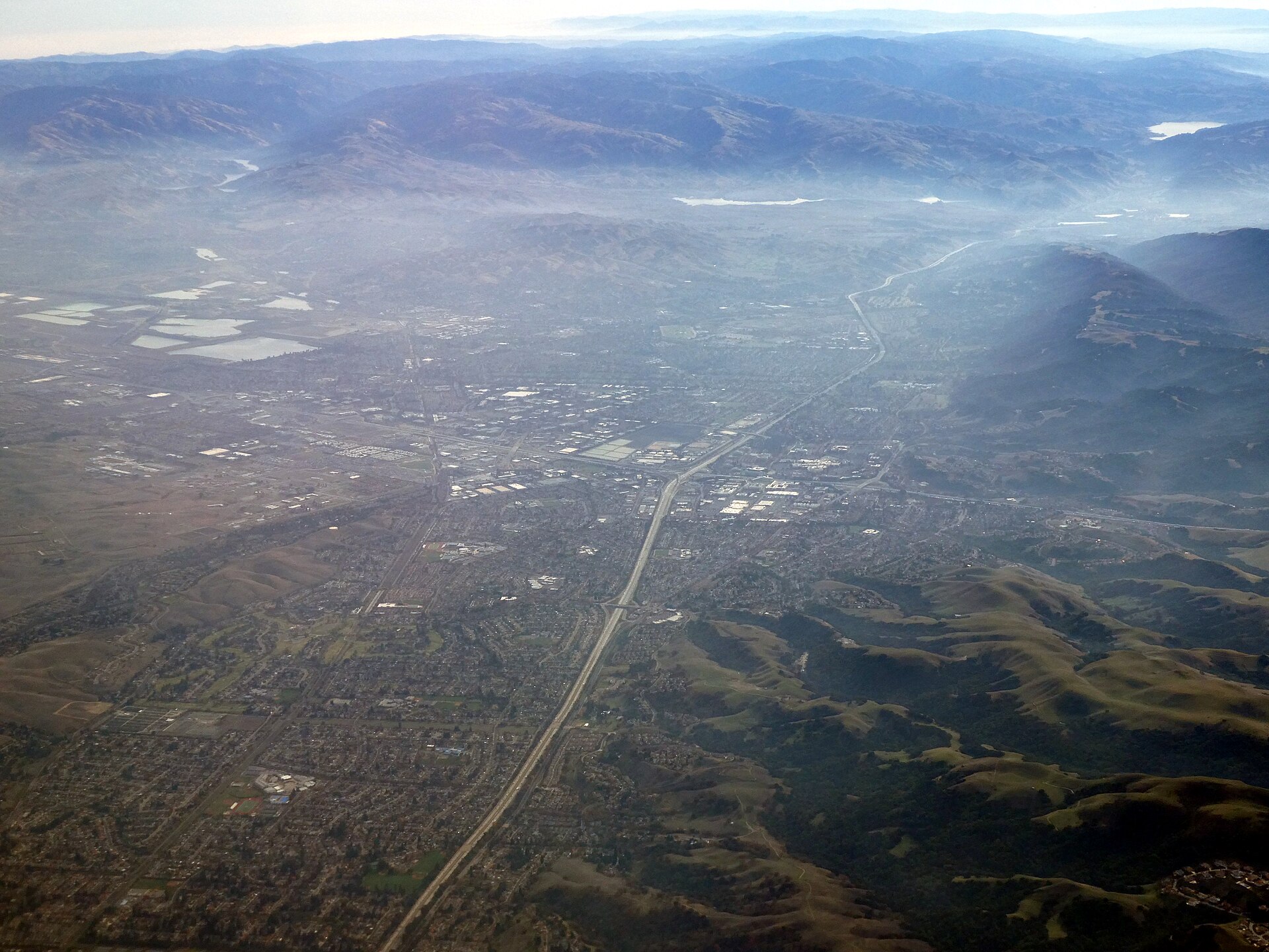 Aerial view of Dublin and Pleasanton with morning fog in December 2023 — California