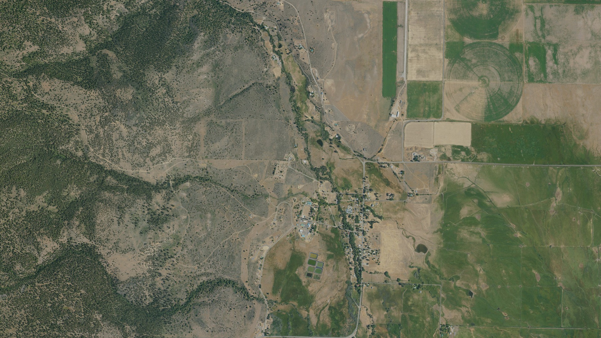 Natural-color aerial photograph of land around Fort Bidwell, California