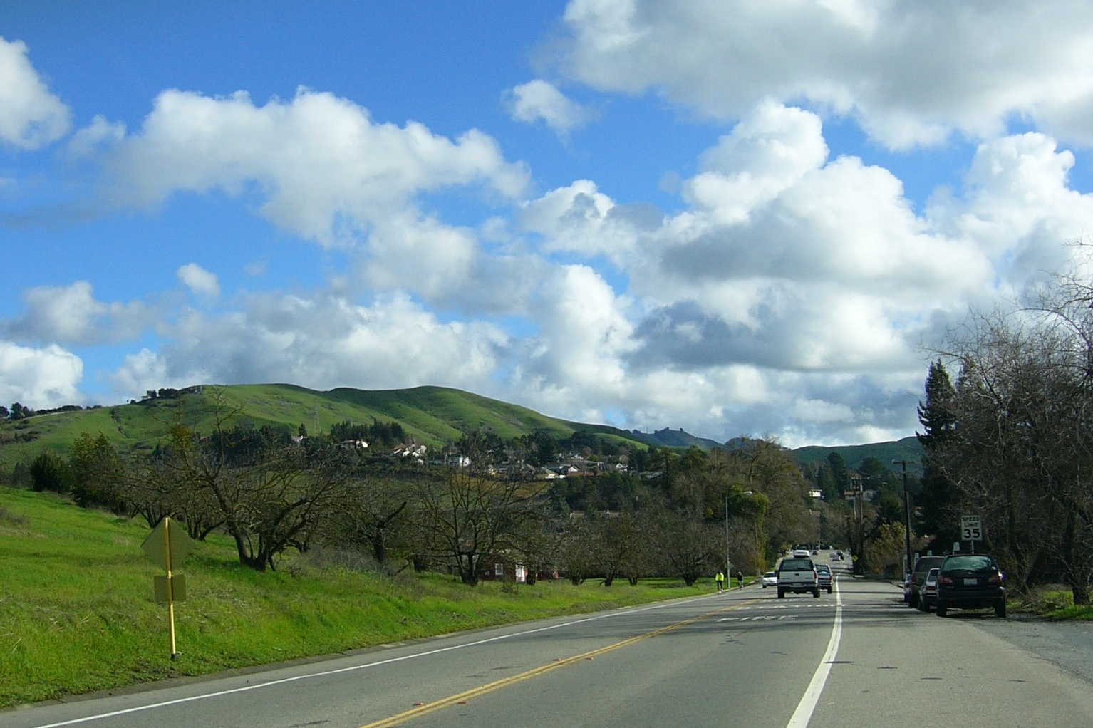 Intersection of Camino Ricardo and Moraga Way, looking east toward Moraga Road. The fire station is on the right and the old pear orchard is on the left. — California