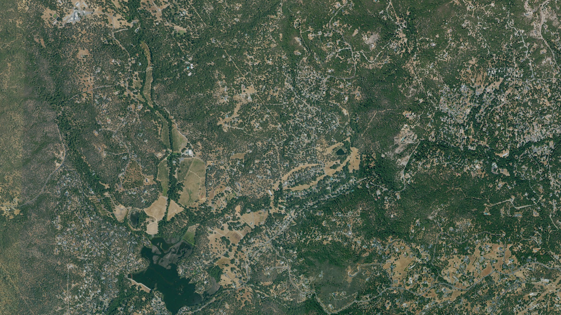 Natural-color aerial photograph of land around Phoenix Lake, California