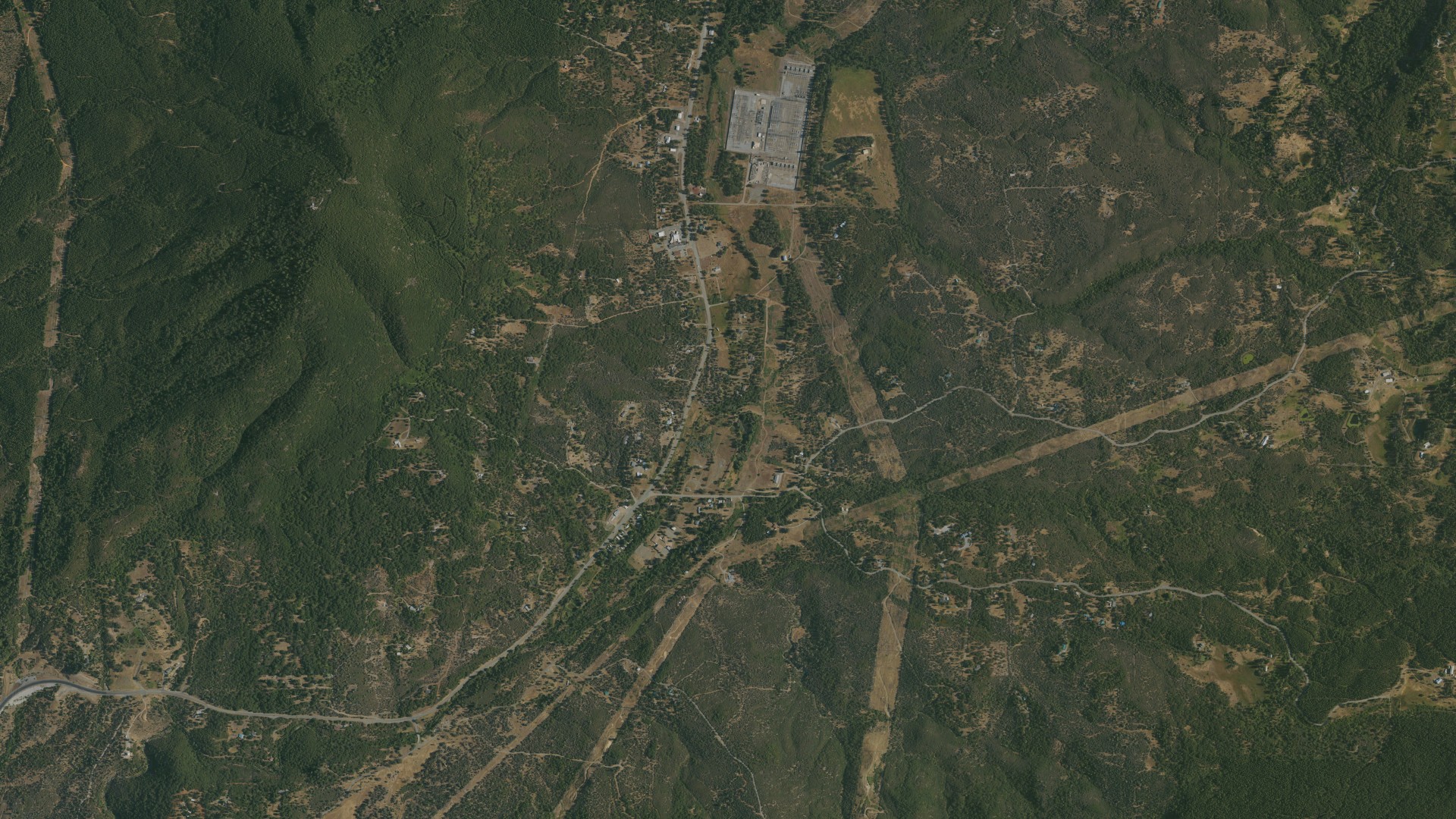 Natural-color aerial photograph of land around Round Mountain, California