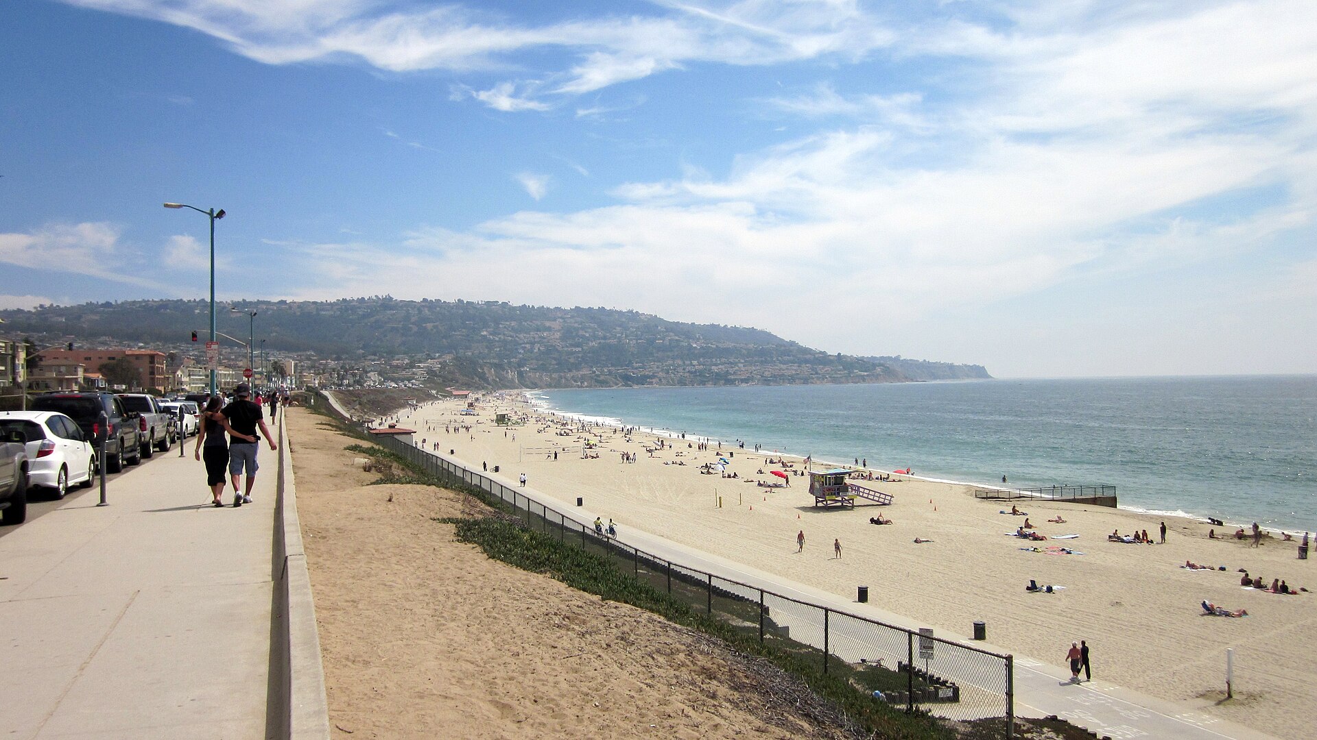View facing south on Esplanade at G Street (approximately) in Redondo Beach of Torrance Beach with Palos Verdes in background. — California