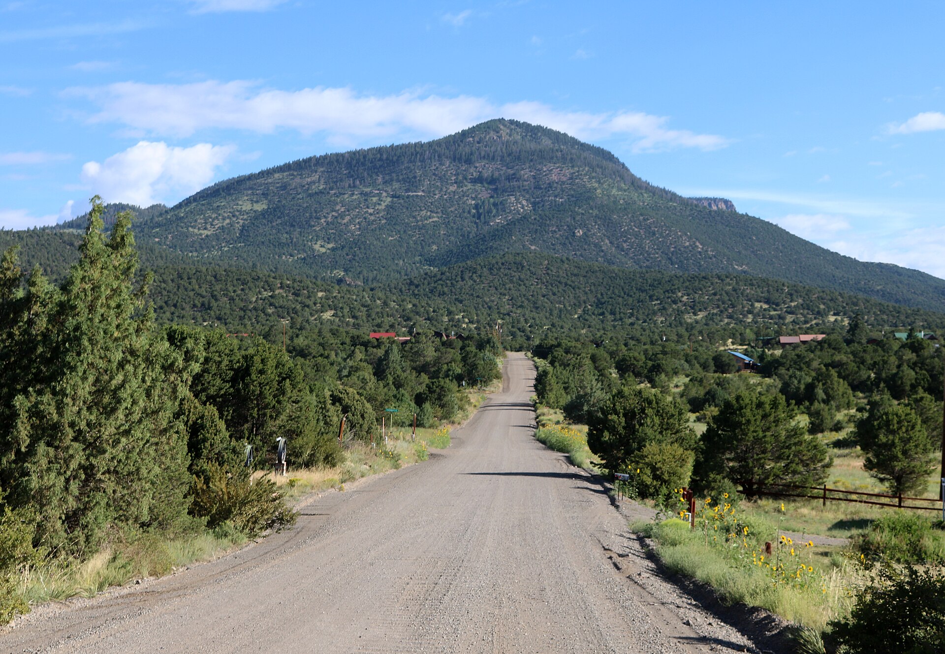 Looking north along Arapaho Road in Alpine, Colorado. The mountain in the picture is Agua Ramon Mountain, south aspect, which has an elevation of 10,857 feet (3,309 meters).