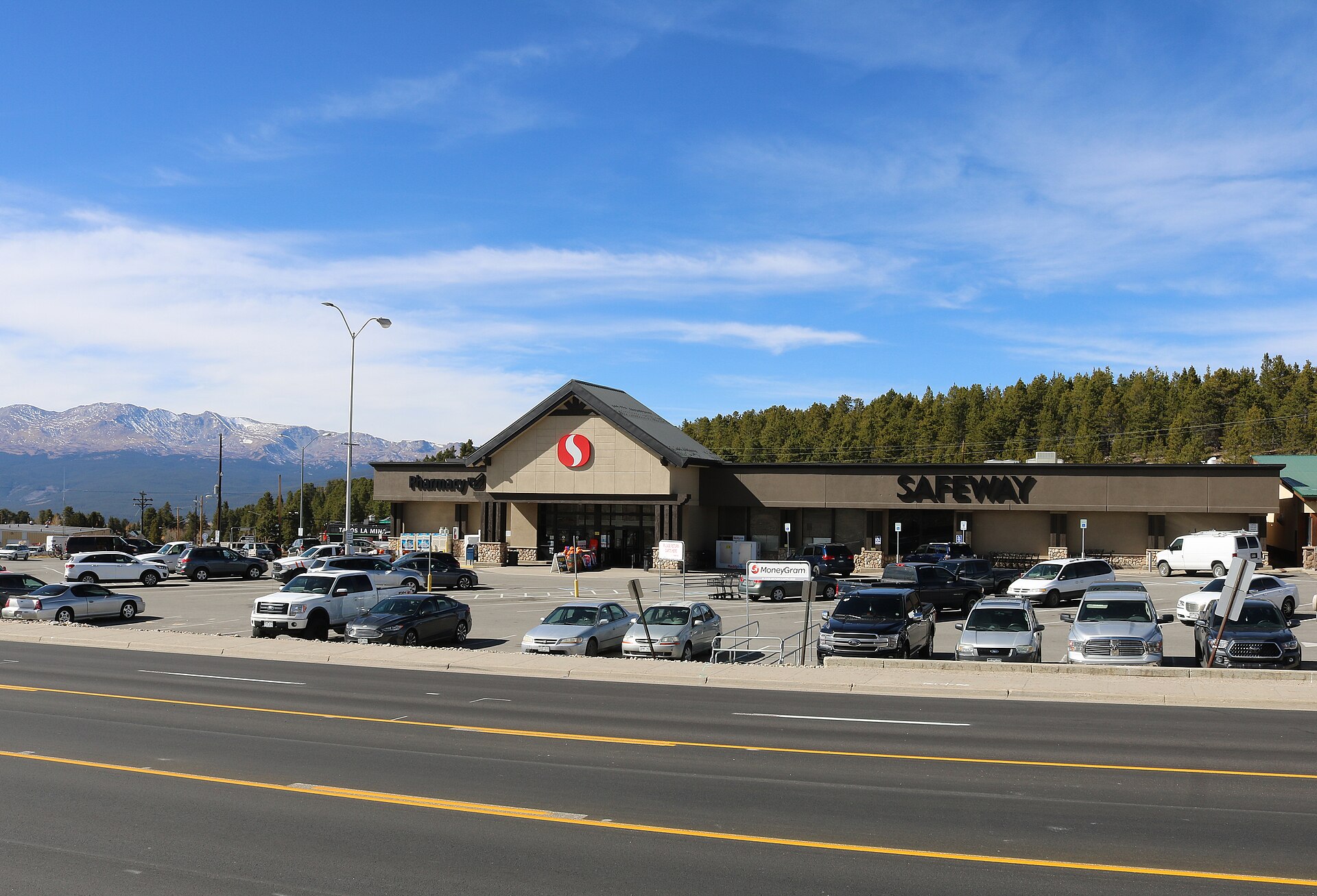 A view of the Safeway store in Leadville North, Colorado. U.S. Route 24 passes in front of the store, and Mount Massive lies in the distance behind it.