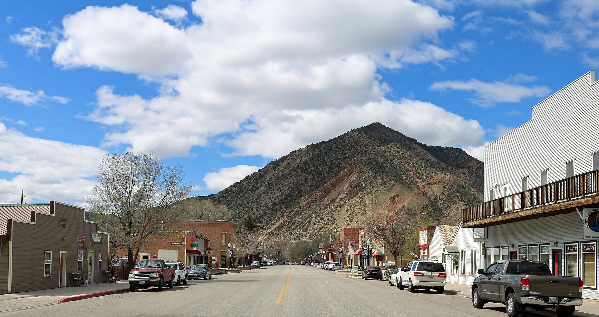 Main Street in New Castle, Colorado. The view is to the west, and the mountain is part of the Grand Hogback.