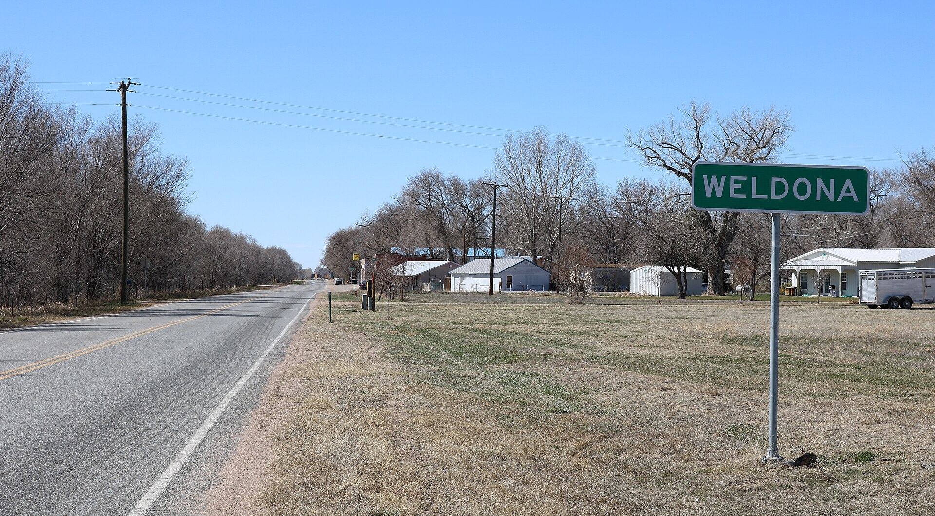 Weldona, Colorado, an unincorporated community in Morgan County. The road on the left is Colorado State Highway 144.