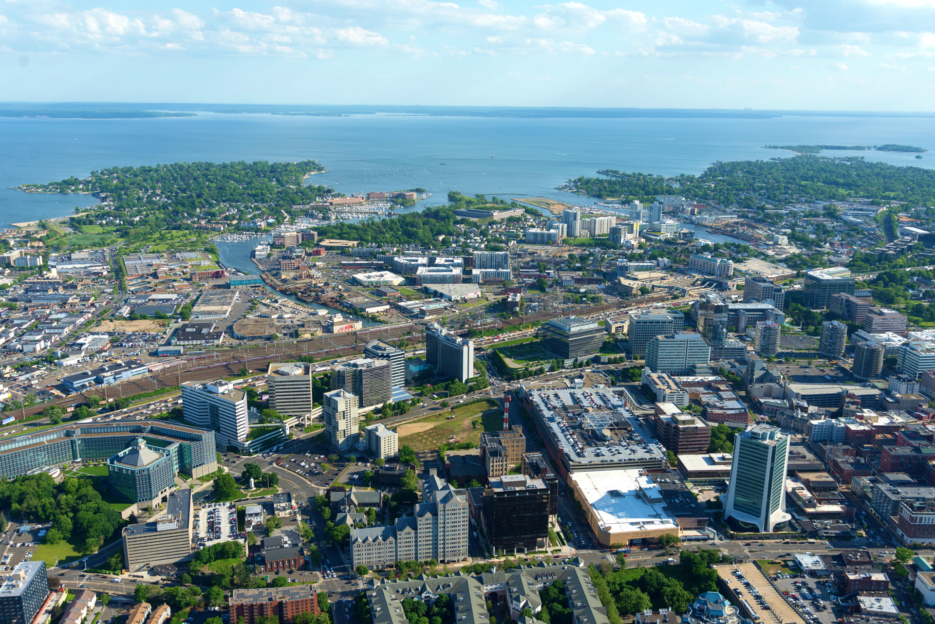 Aerial drone shot of the Stamford skyline in Downtown and South End neighbrohoods of Stamford, Connecticut with Long Island in the distance. — Western Connecticut Planning Region, Connecticut