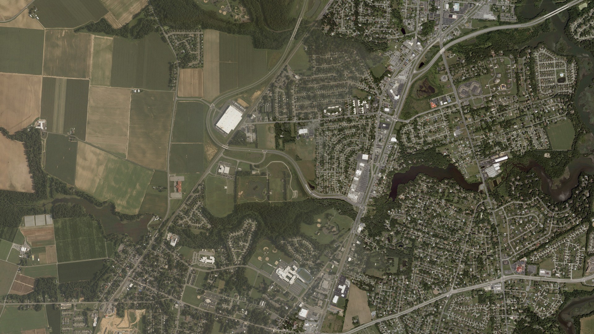 Natural-color aerial photograph of land around Rodney Village, Delaware