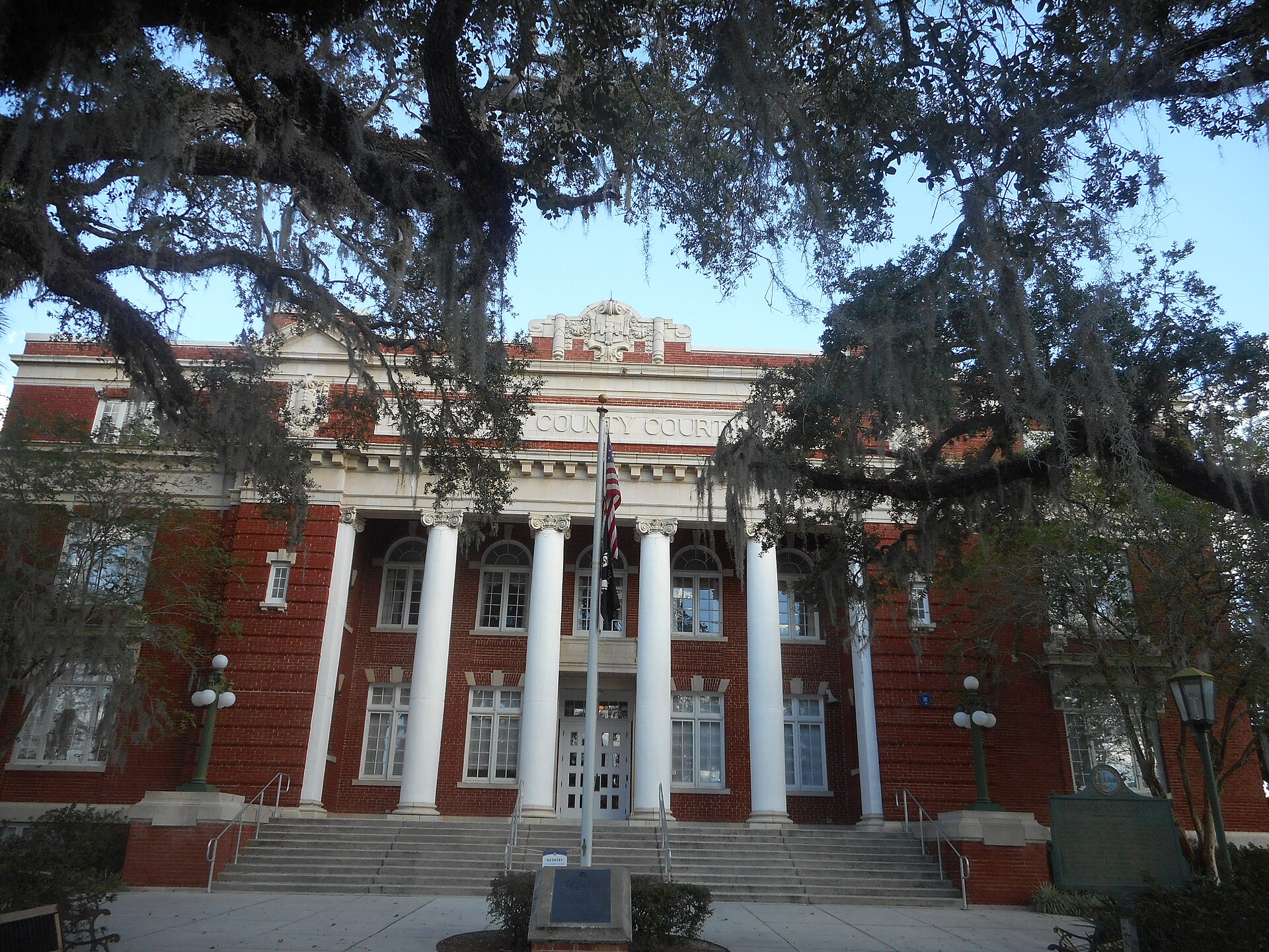 An attempt to capture the columns, crest and other neo-classical features on the Hernando County Courthouse in Brooksville, Florida, that sadly is obstructed by many trees on the property.