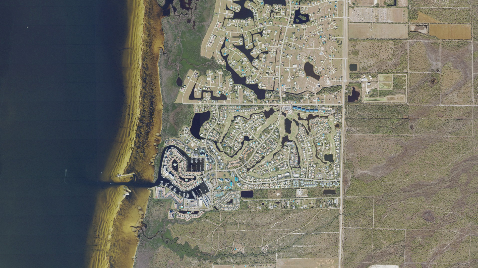 Natural-color aerial photograph of land around Burnt Store Marina, Florida