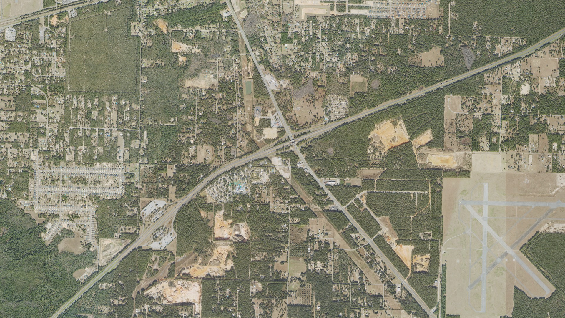 Natural-color aerial photograph of land around East Milton, Florida