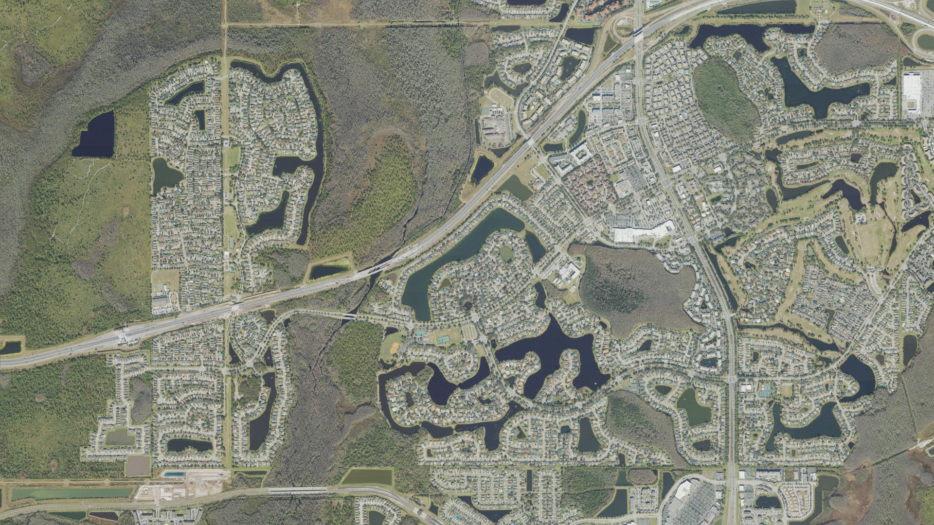 Natural-color aerial photograph of land around Hunters Creek, Florida