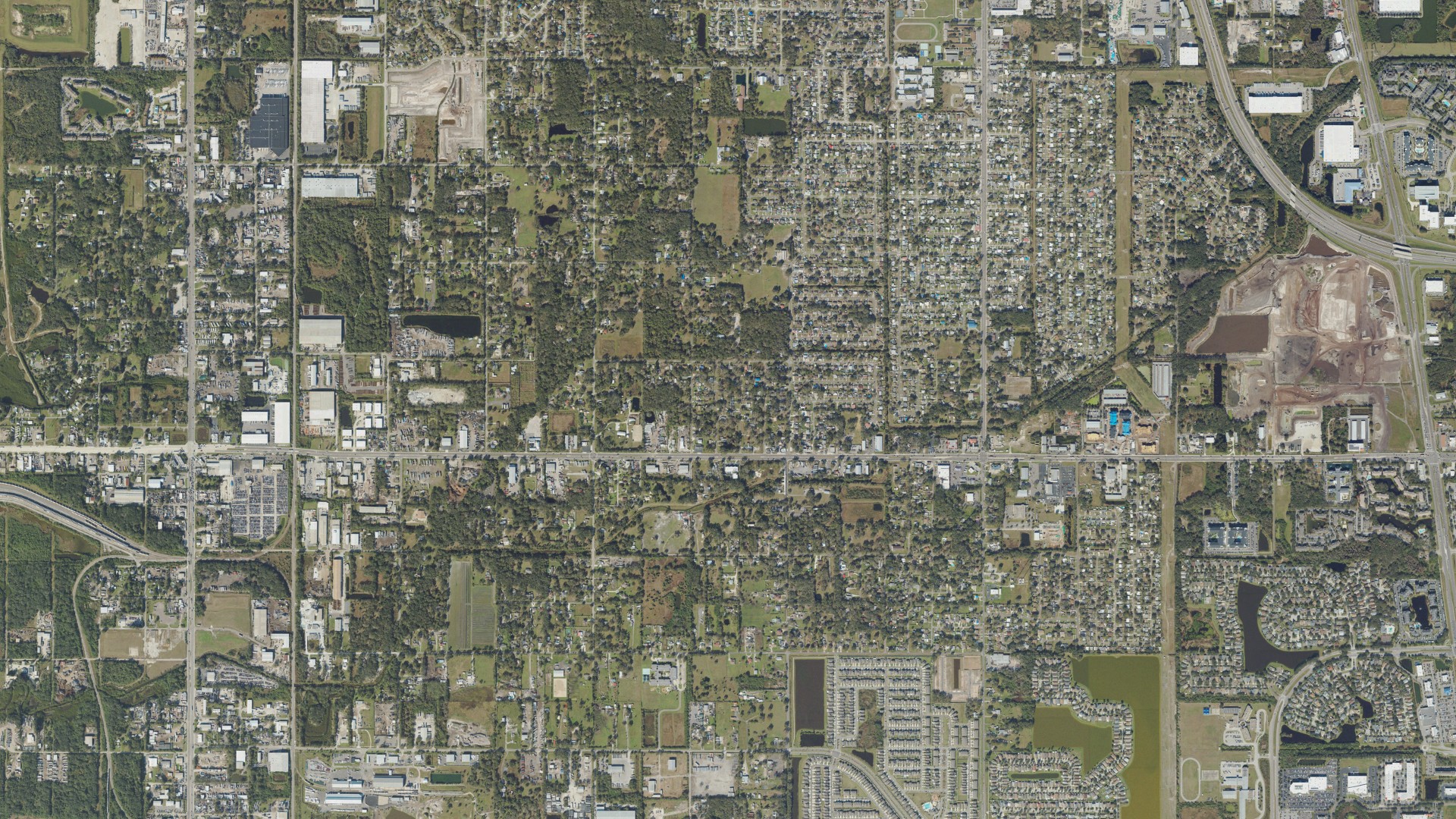 Natural-color aerial photograph of land around Palm River-Clair Mel, Florida