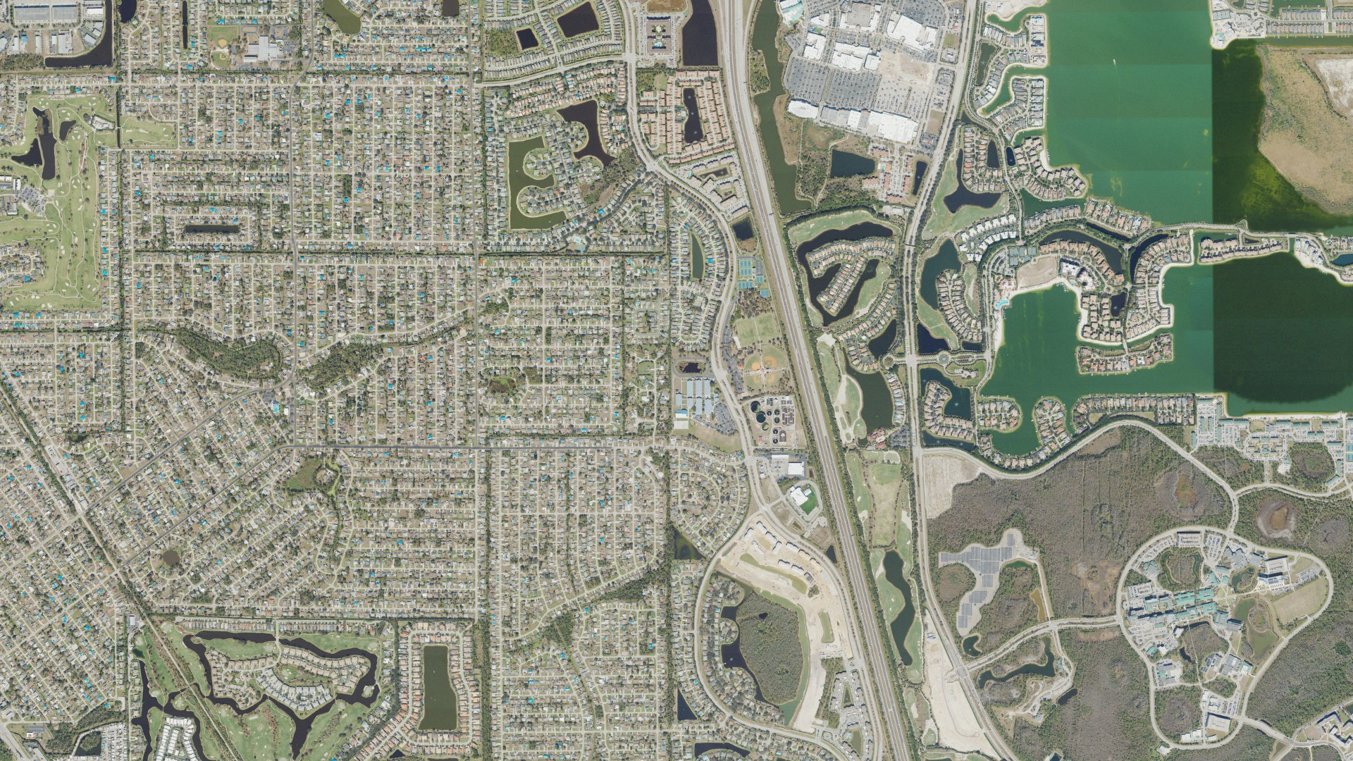 Natural-color aerial photograph of land around Three Oaks, Florida