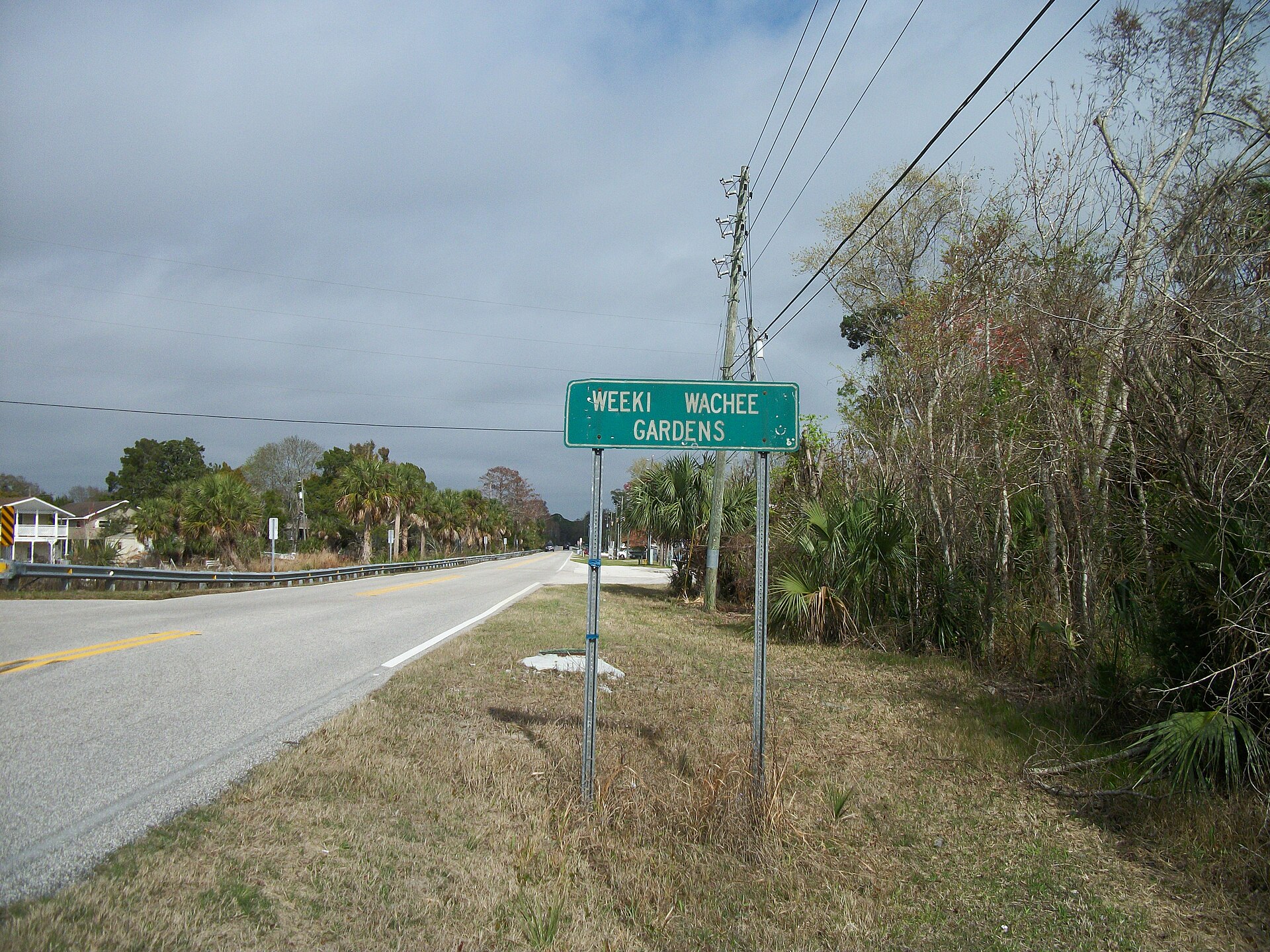 Northbound Hernando County Road 597 as it enters Weeki Wachee Gardens, Florida from Hernando Beach, Florida. Taken from what passes for the shoulder of the road, and putting my car and myself at risk.