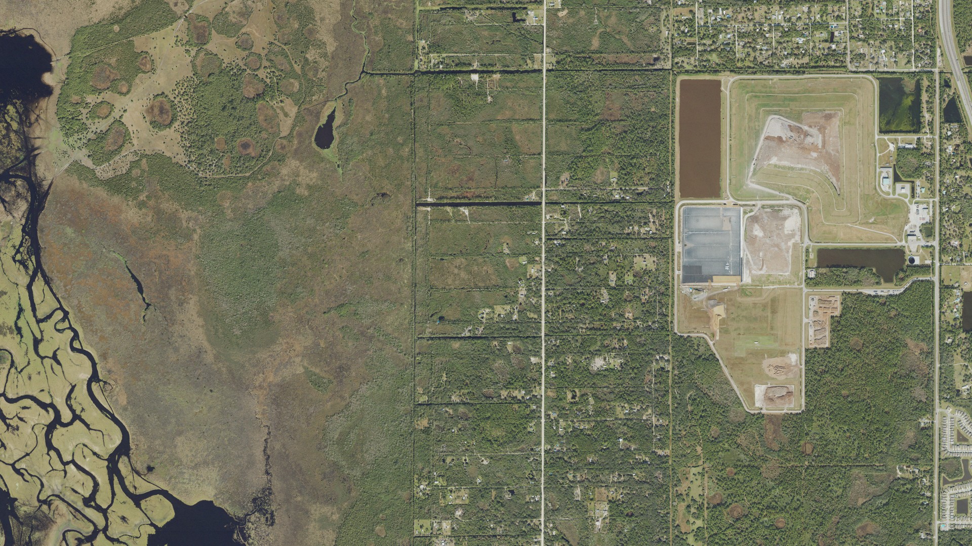 Natural-color aerial photograph of land around West Canaveral Groves, Florida