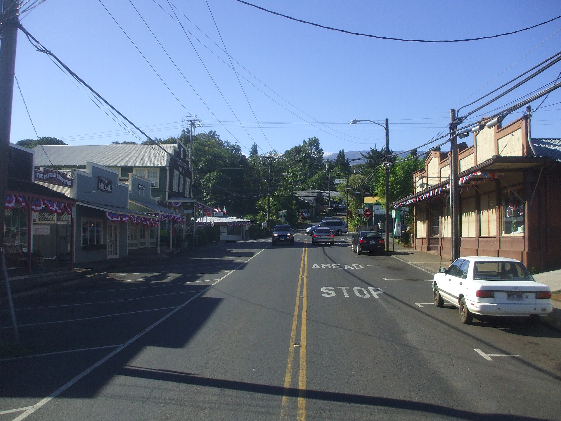 Looking up on Baldwin Ave. towards the Baldwin Ave/Makawao Ave/Olinda Road Intersection in Makawao. Komoda Store & Bakery is to the right of the picture (Off White/Brown Building). — Hawaii