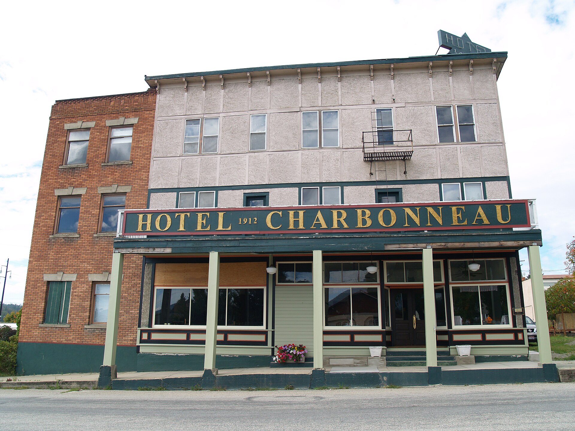 Front elevation of hotel with new paint scheme. — Priest River, Idaho