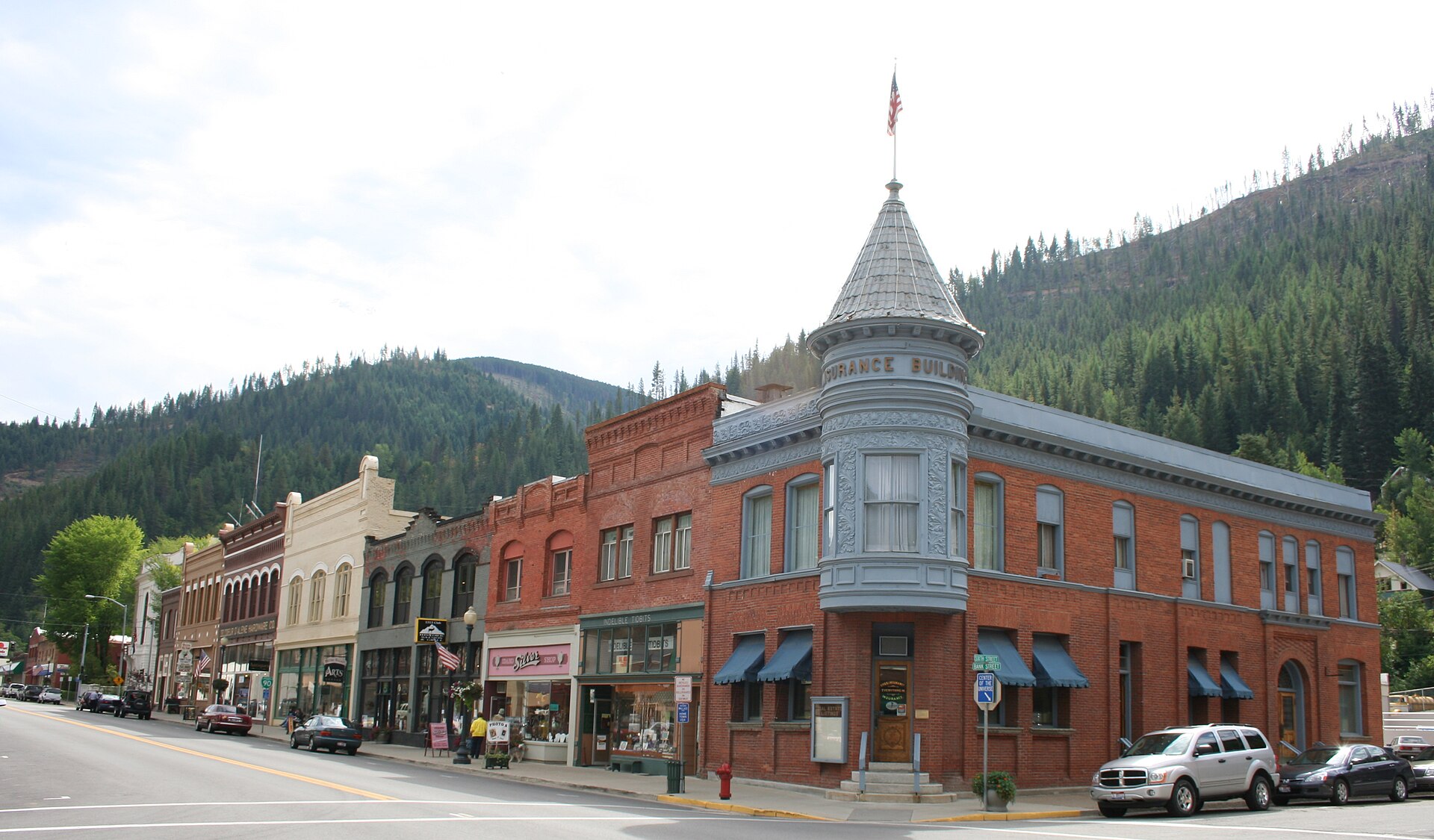 Intersection of Sixth and Bank Streets in Wallace, Idaho, United States. The buildings pictured are part of the Wallace Historic District, which is listed on the National Register of Historic Places.