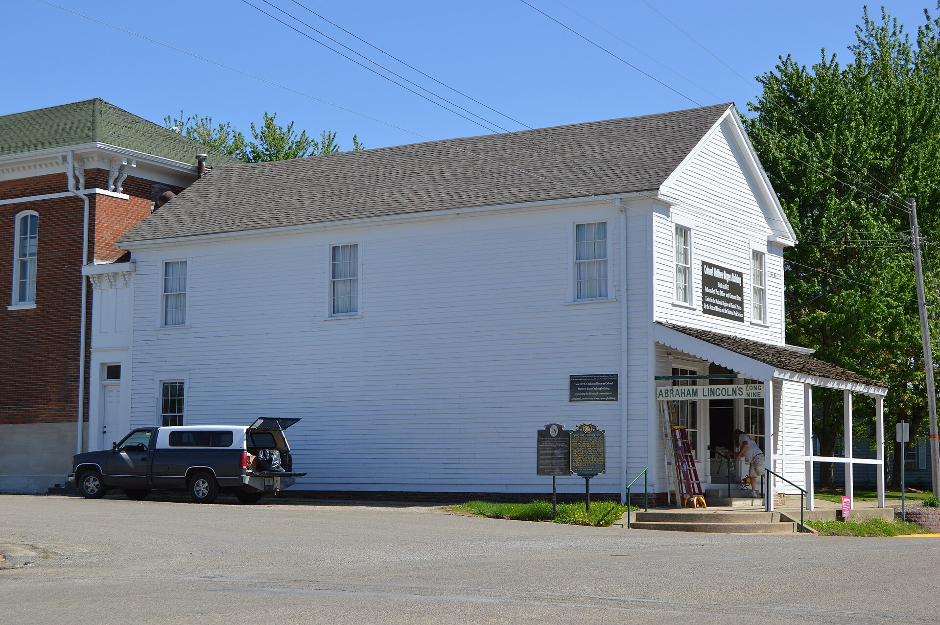 Northern side and front of the Col. Matthew Rogers Building, located at 200 S. Main Street in Athens, Illinois, United States. Built in 1832, it is listed on the National Register of Historic Places.
