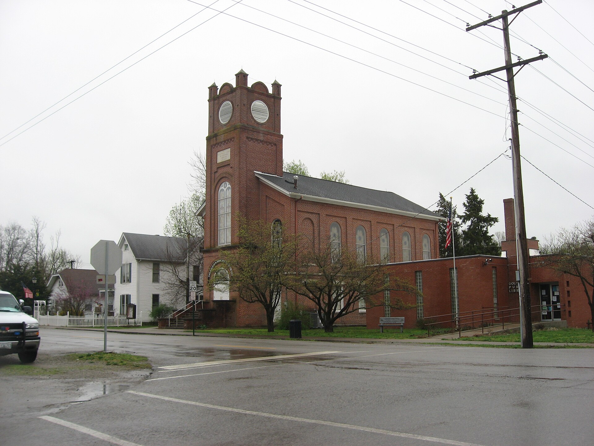 Houses, the Presbyterian church (built 1869), and the library in Golconda, Illinois, United States; the photo is taken from Adams Street (Illinois Route 146) and looks eastward on Main Street.