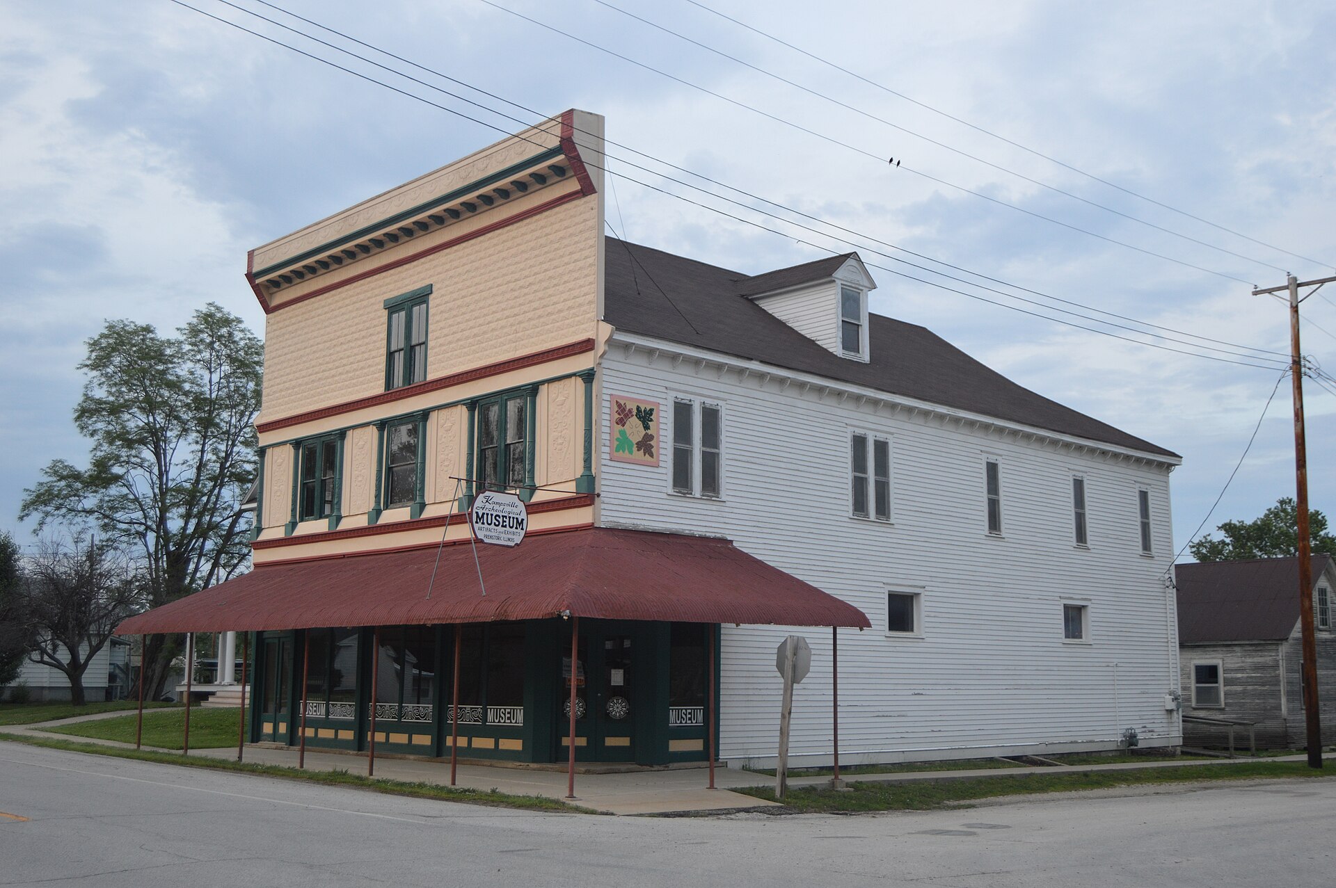 Front and southern side of the Kamp Store, located on the northeastern corner of the junction of Broadway (Illinois Route 100) and Oak Street in Kampsville, Illinois, United States.