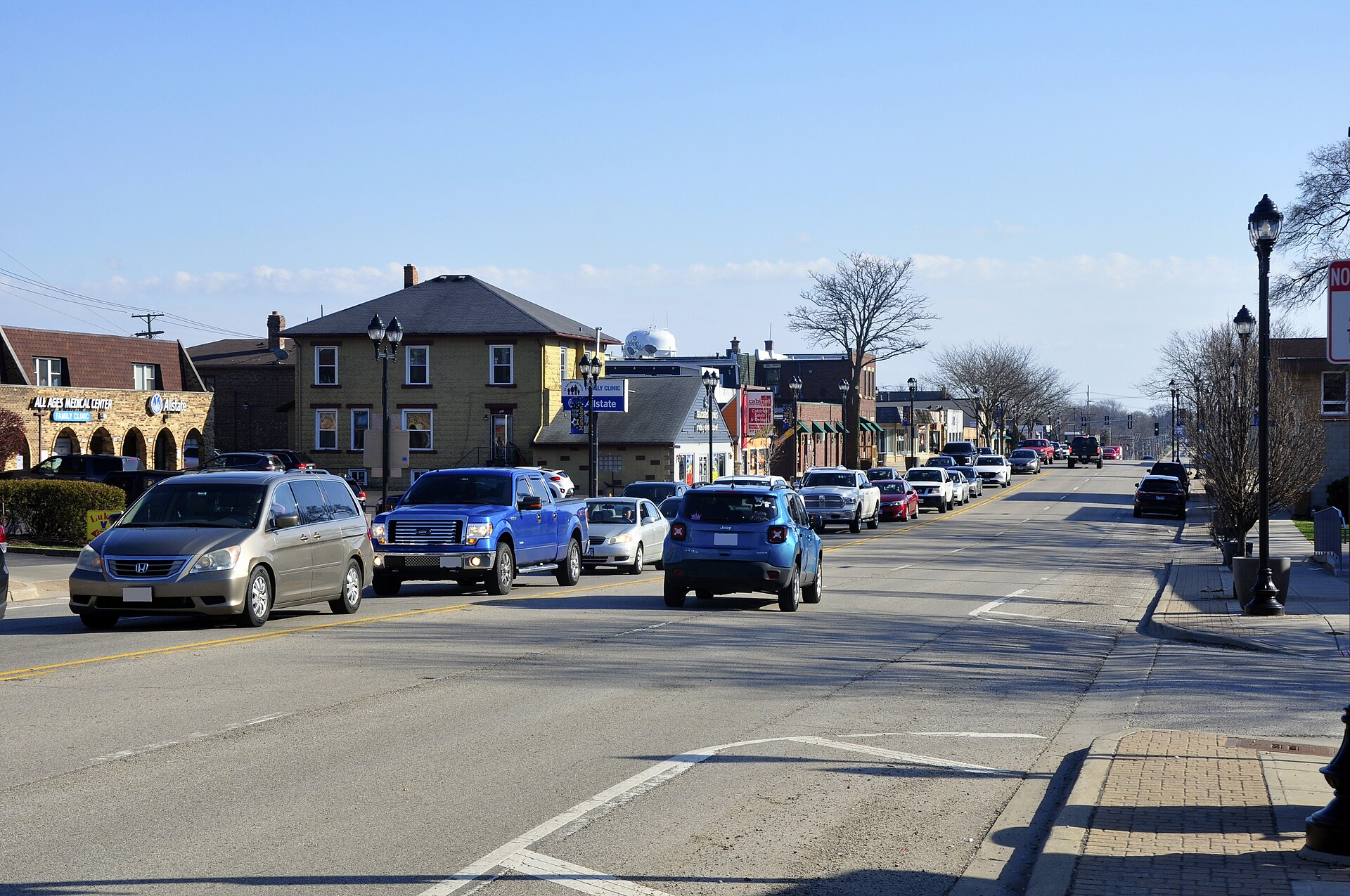 This is a photograph I took of the downtown of the village of Mundelein on March 28, 2024. — Illinois
