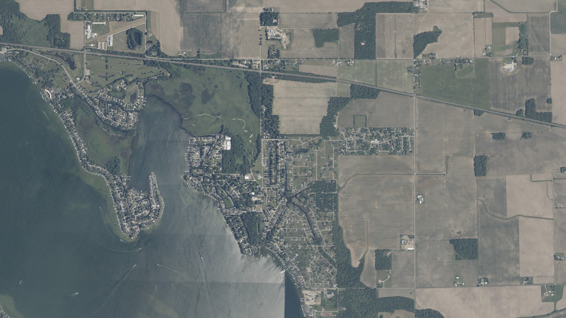 Natural-color aerial photograph of land around Enchanted Hills, Indiana