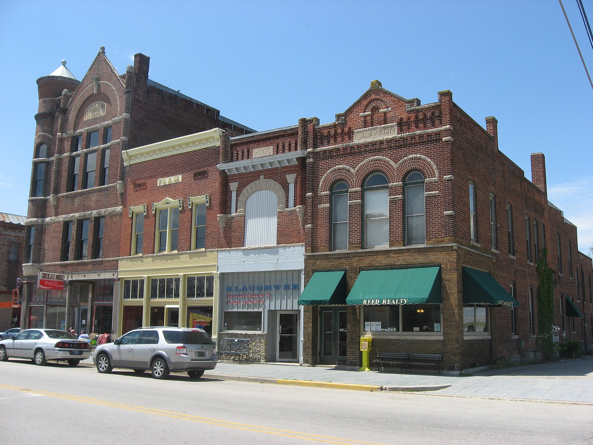 Buildings on the western side of Main Street between Williams and Henry Streets in downtown Farmland, Indiana, United States.