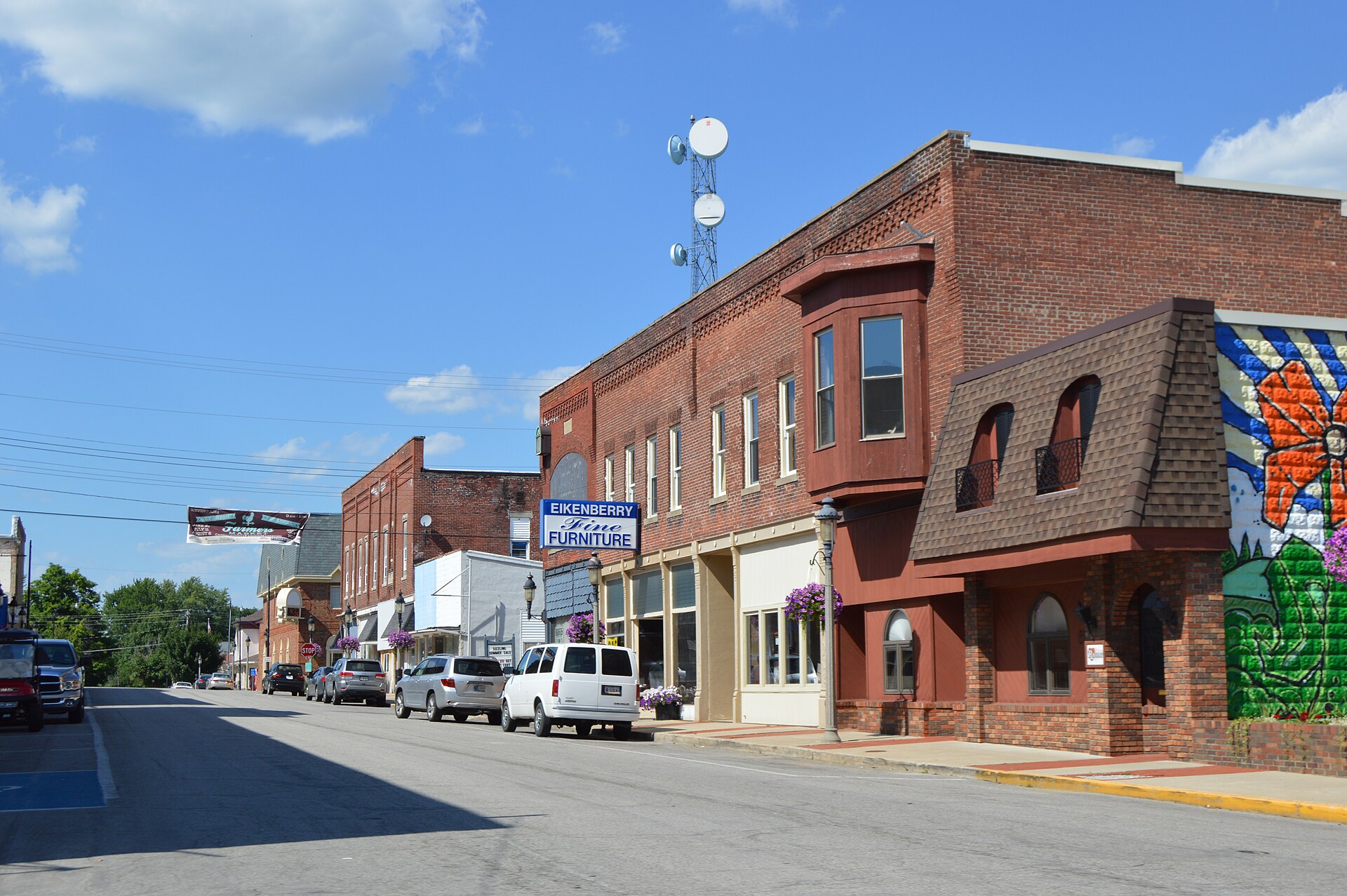 Buildings on the eastern side of Center Street, seen looking north from Columbia Street (State Road 18) in downtown Flora, Indiana, United States.