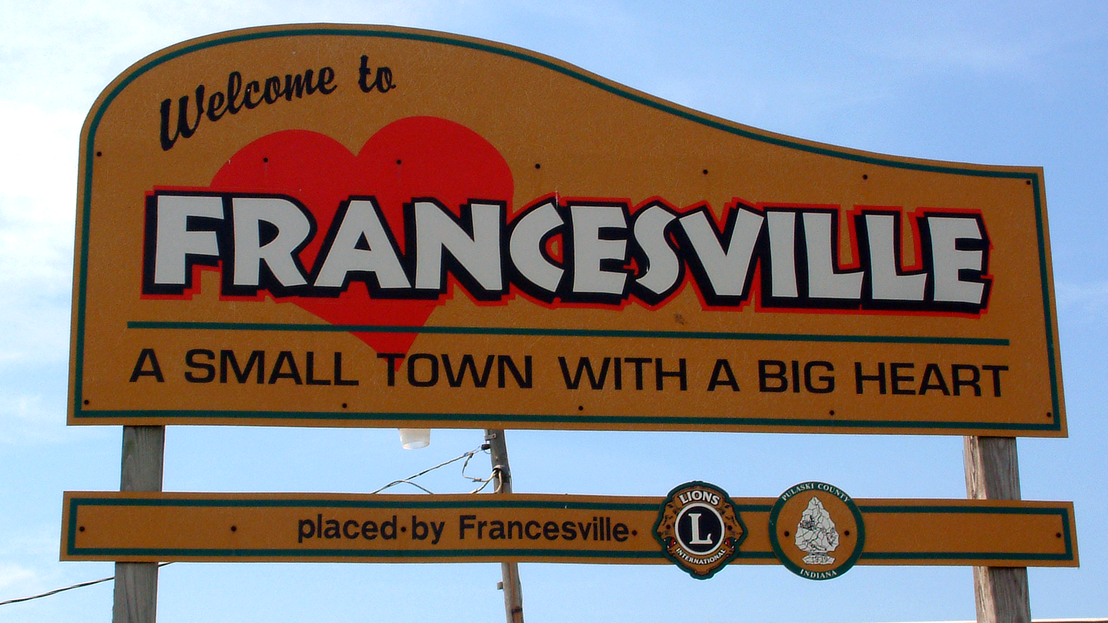 A sign welcomes visitors to the town of Francesville, Indiana.