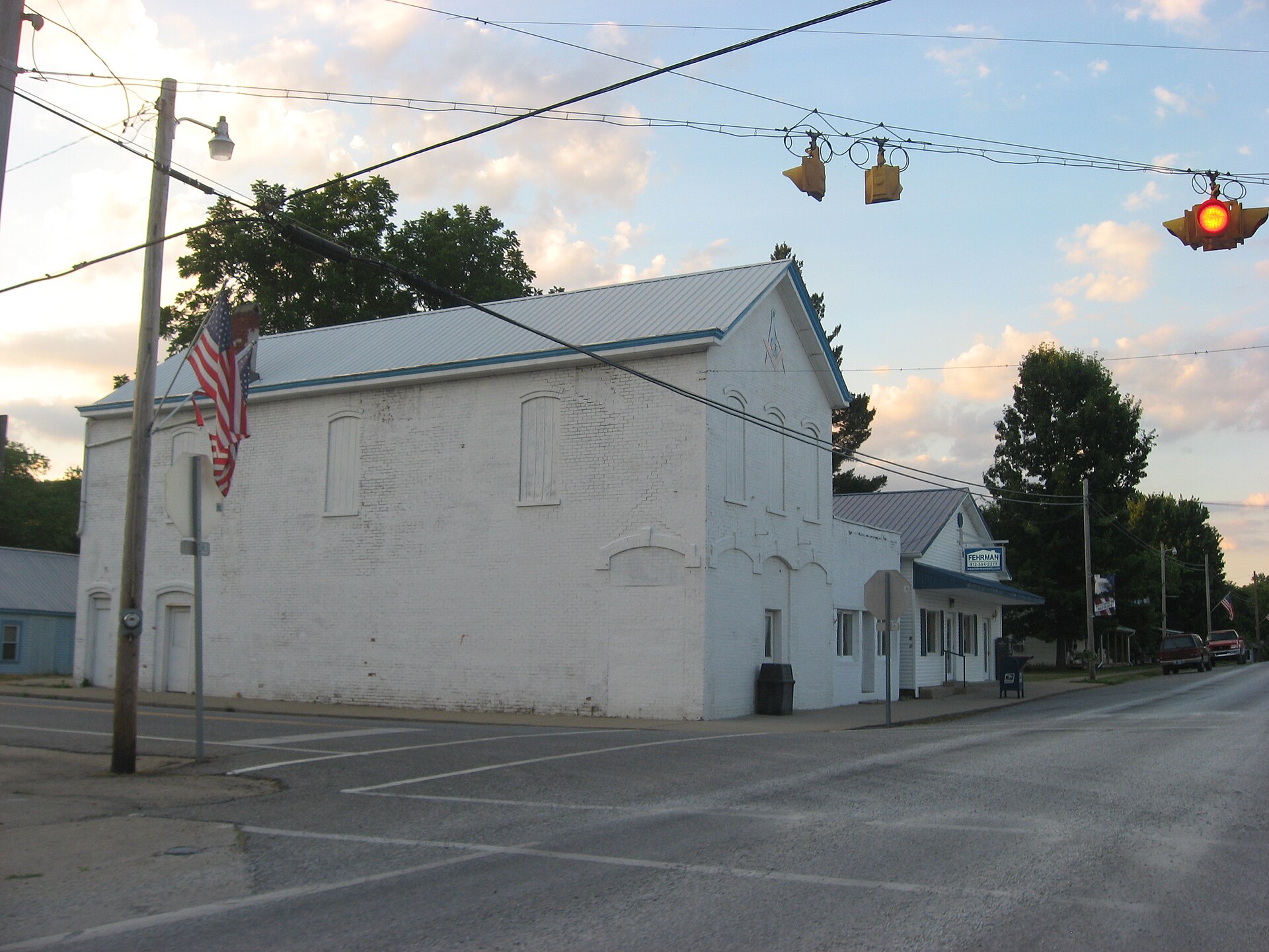 Buildings on the western side of Main Street (State Road 156) at the State Street intersection in central Patriot, Indiana, United States.