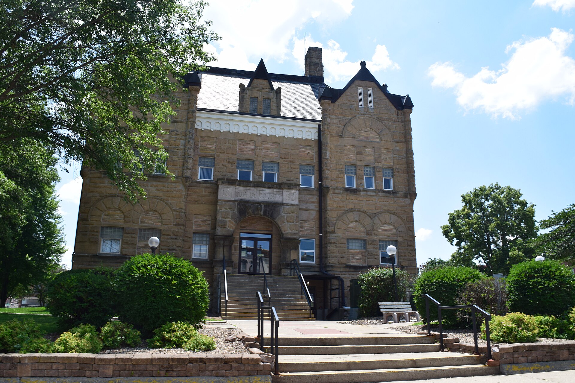 The west side of the Shelby County Courthouse in Harlan, Iowa. The courthouse is listed on the National Register of Historic Places.