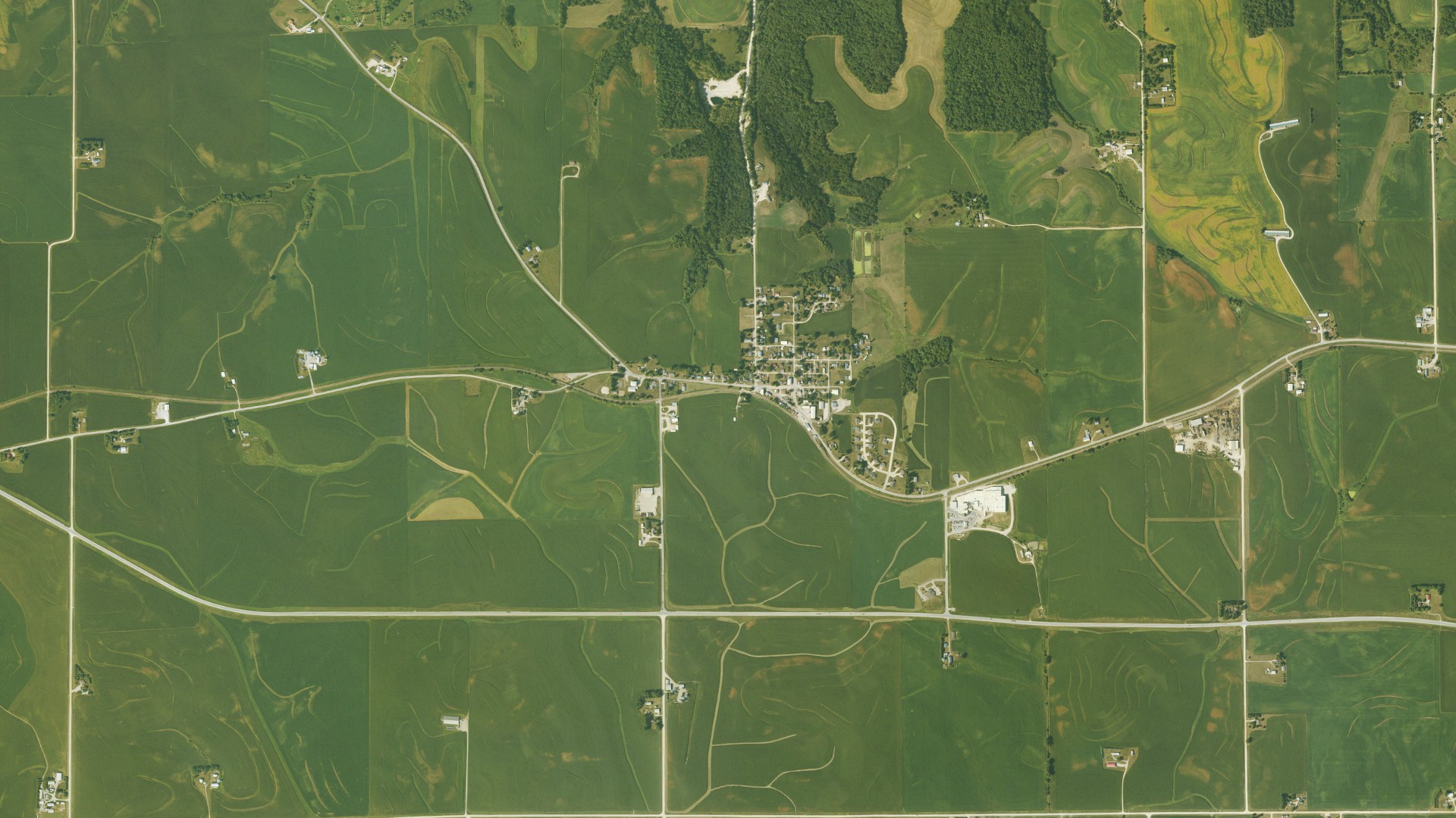 Natural-color aerial photograph of land around Luana, Iowa