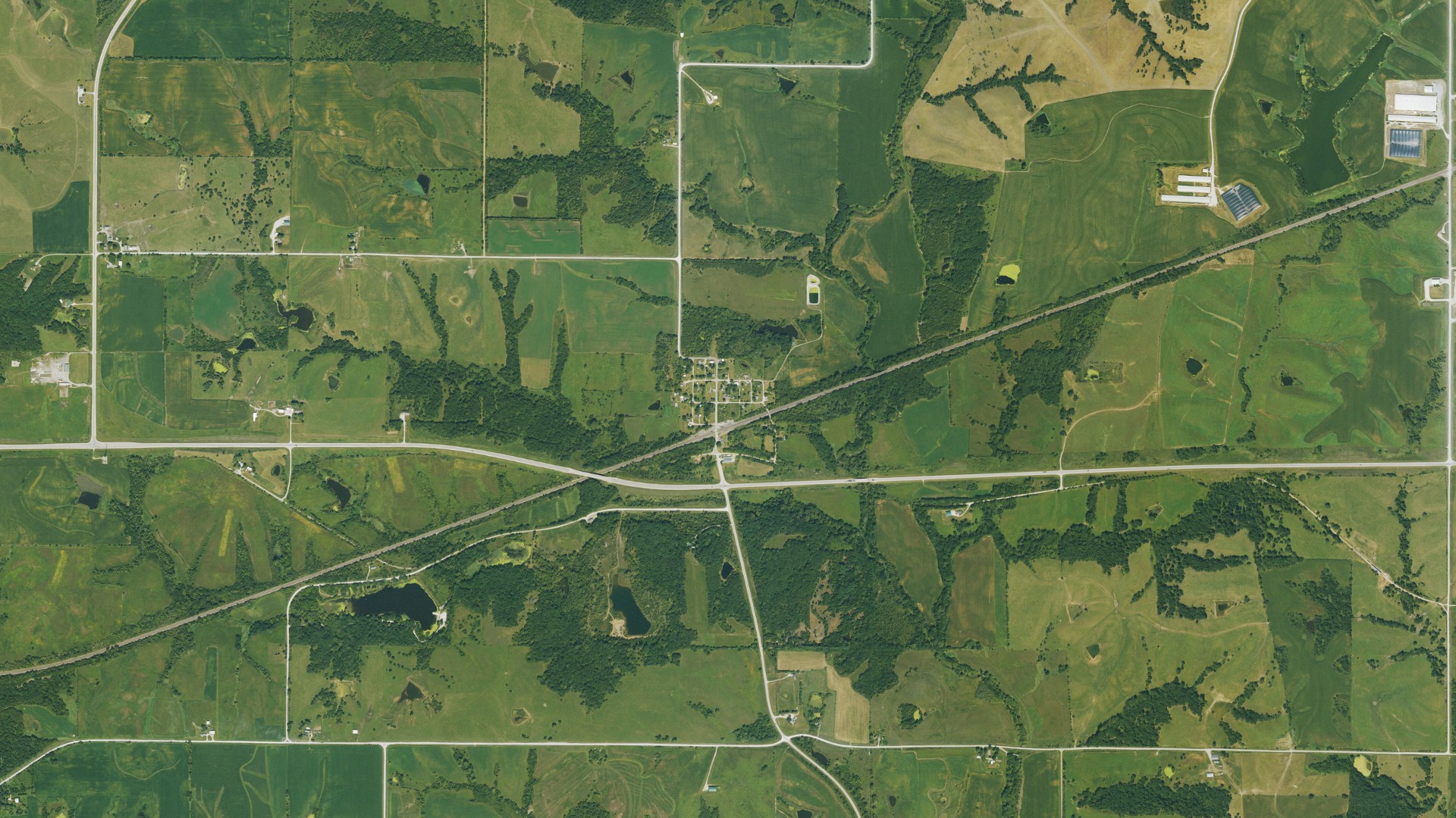 Natural-color aerial photograph of land around Thayer, Iowa