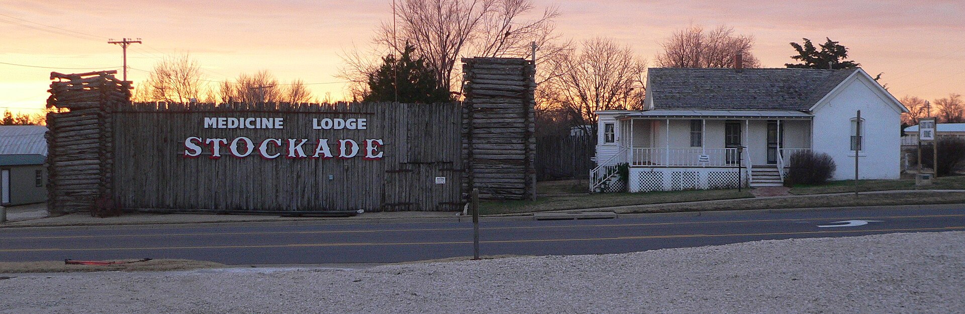 Medicine Lodge Stockade Museum (left) and Carry A. Nation house (right), on the south side of Fowler Street (U.S. Highway 160) east of Oak Street in Medicine Lodge, Kansas; seen from the north. — Barber County, Kansas