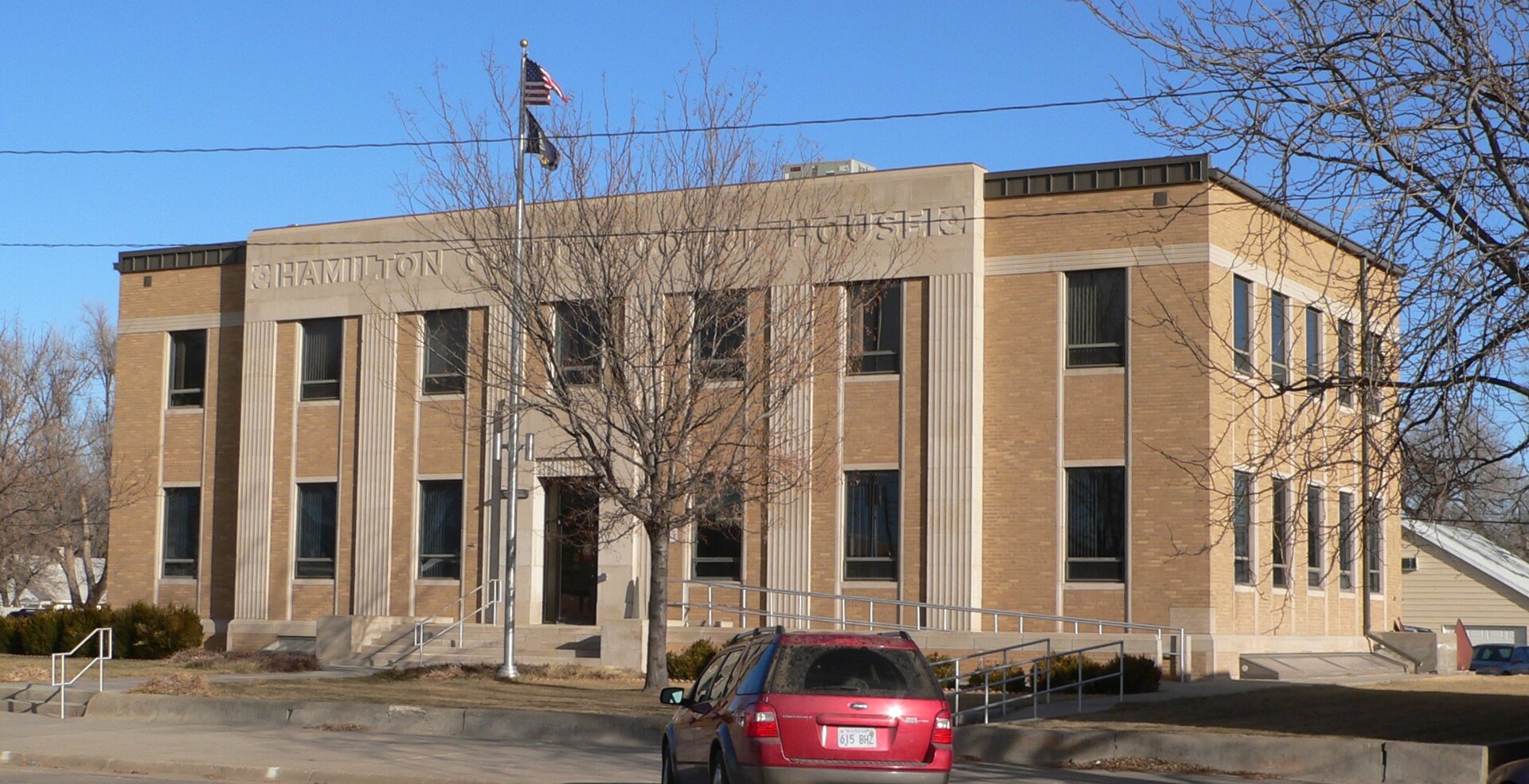 Hamilton County courthouse in Syracuse, Kansas; seen from the southwest. The Art Deco building was designed by architects Overend & Boucher, and built in 1937.