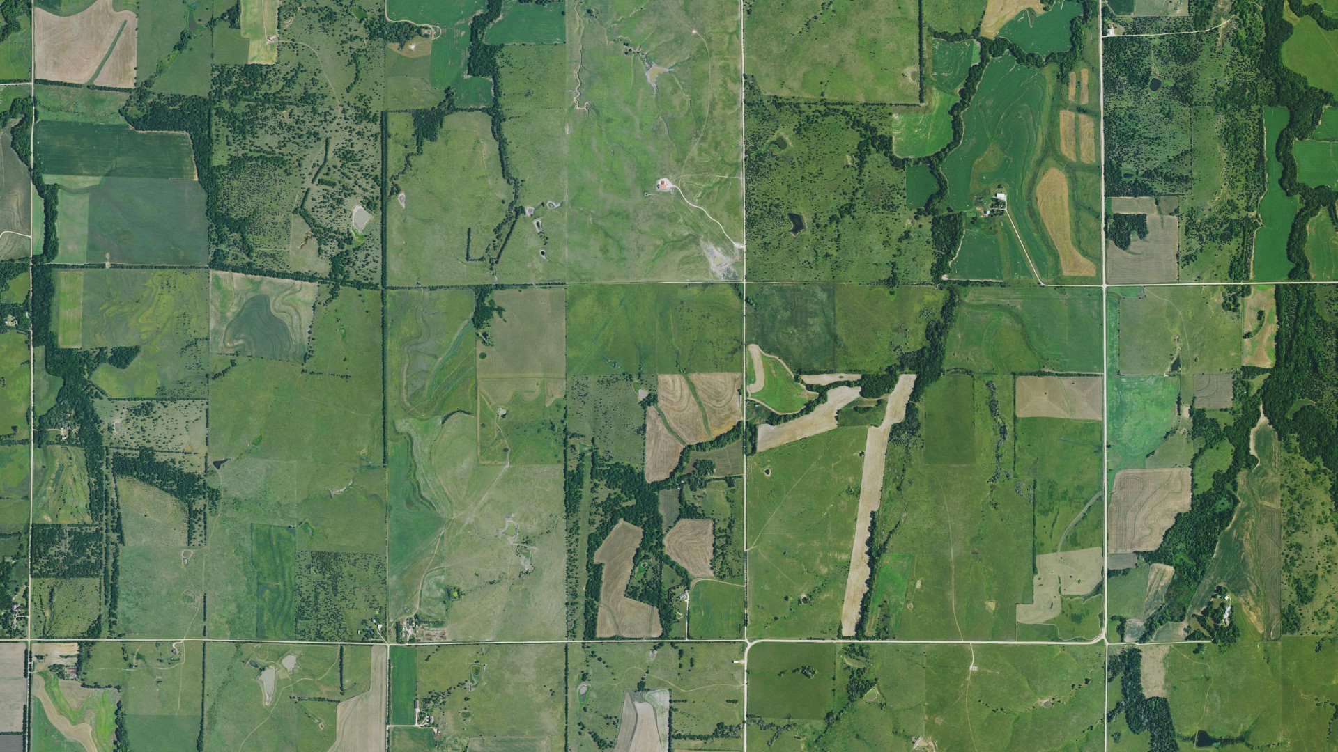 Natural-color aerial photograph of land around Delmore, Kansas
