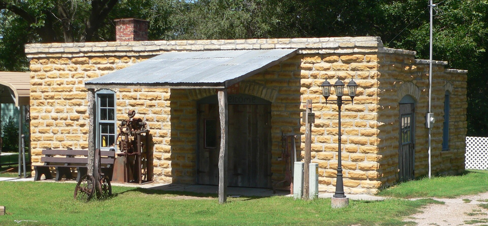 Blacksmith shop, located on north side of Lynn Street west of Baird Street in Cuba, Kansas; seen from the southeast.