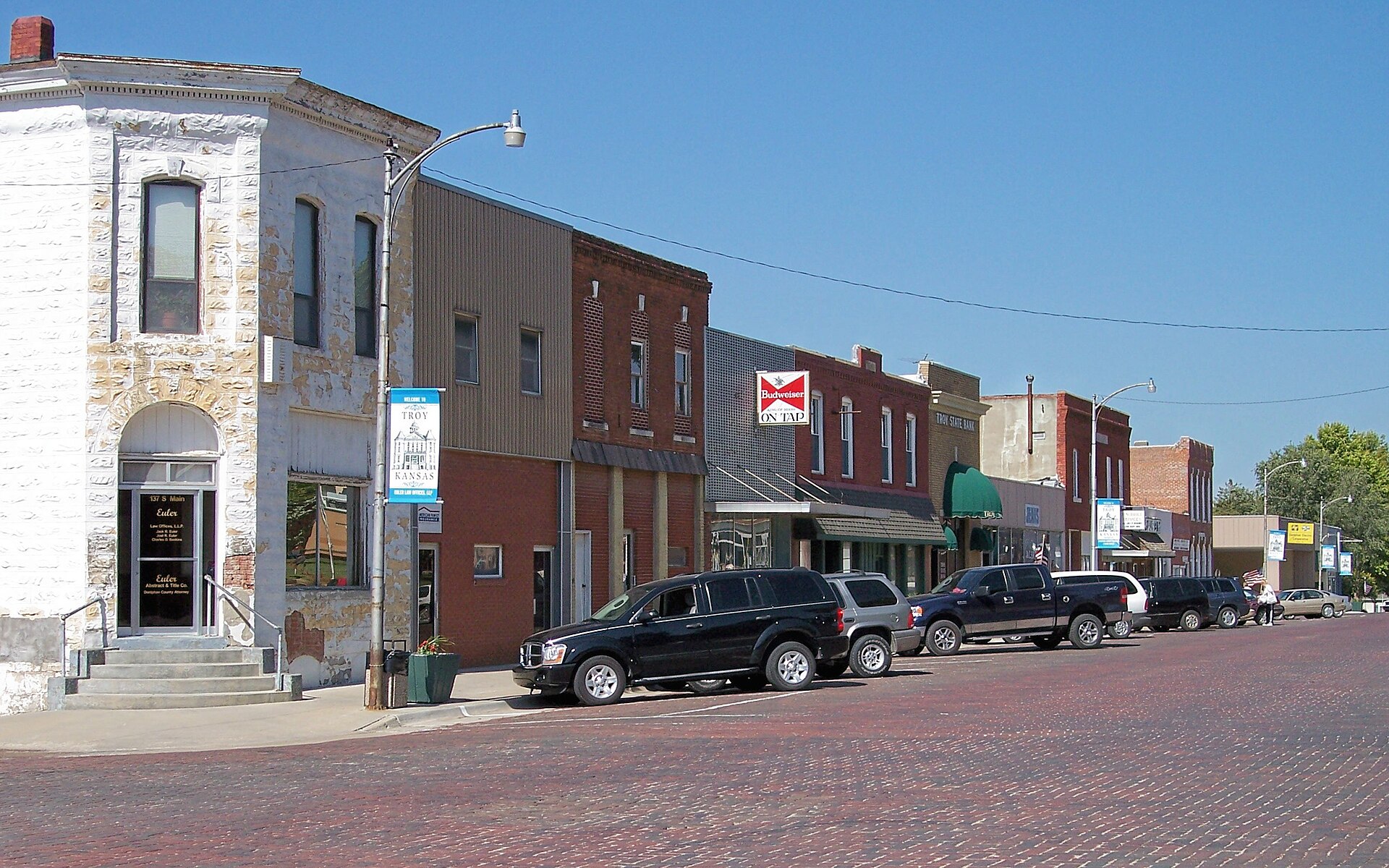 Along South Main Street in the Doniphan County Courthouse Square Historic District in downtown Troy, Kansas, United States. The district is listed on the National Register of Historic Places.
