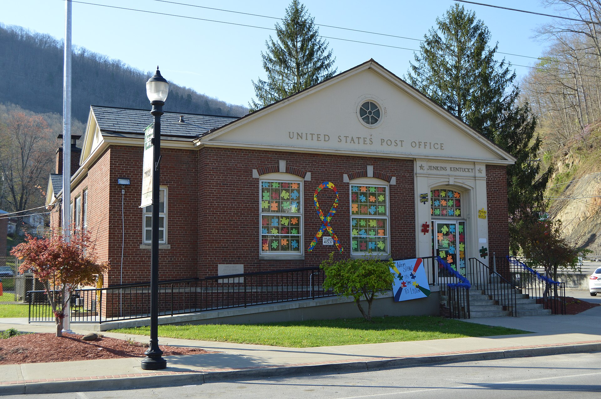 Front of the post office in Jenkins, Kentucky, United States, located on the eastern corner of the junction of Kentucky Route 3086 with Main Street (Kentucky Route 805).