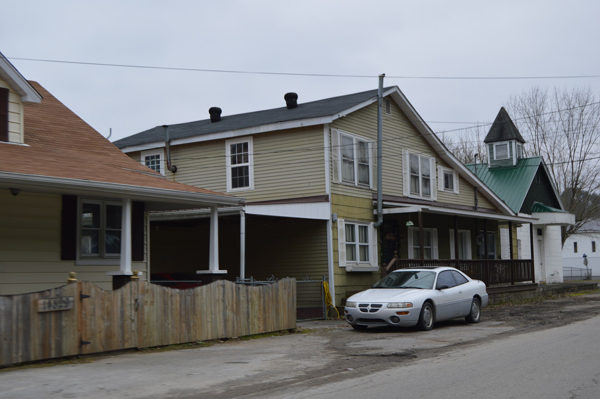 Buildings on the southern side of River Street (Kentucky Route 66) just west of Second Street in Oneida, Kentucky, United States.